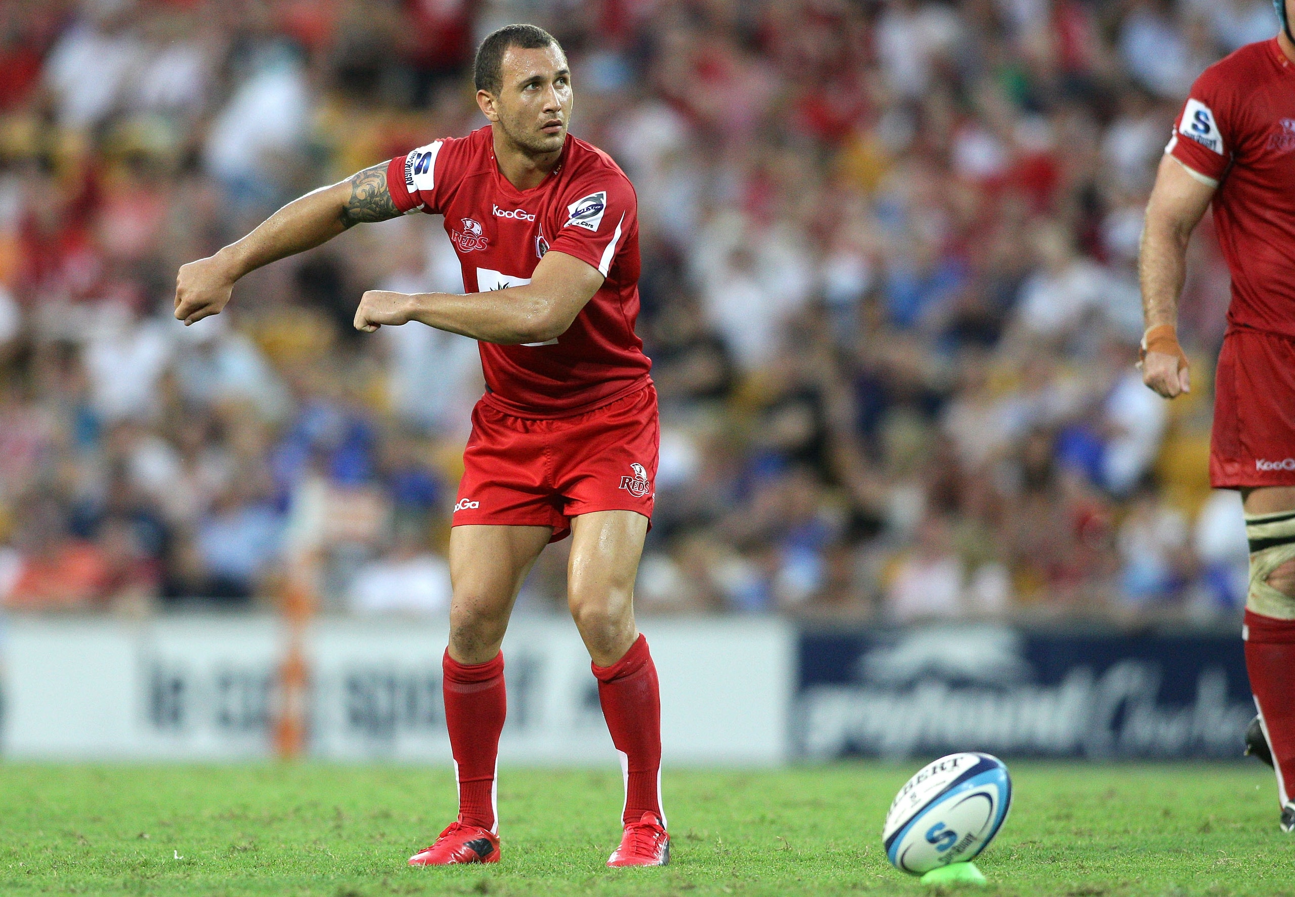 BRISBANE, AUSTRALIA - FEBRUARY 20: Quade Cooper of the Reds lines up a kick for goal during the round one Super Rugby match between the Reds and the Western Force at Suncorp Stadium on February 20, 2011 in Brisbane, Australia.  (Photo by Bradley Kanaris/G