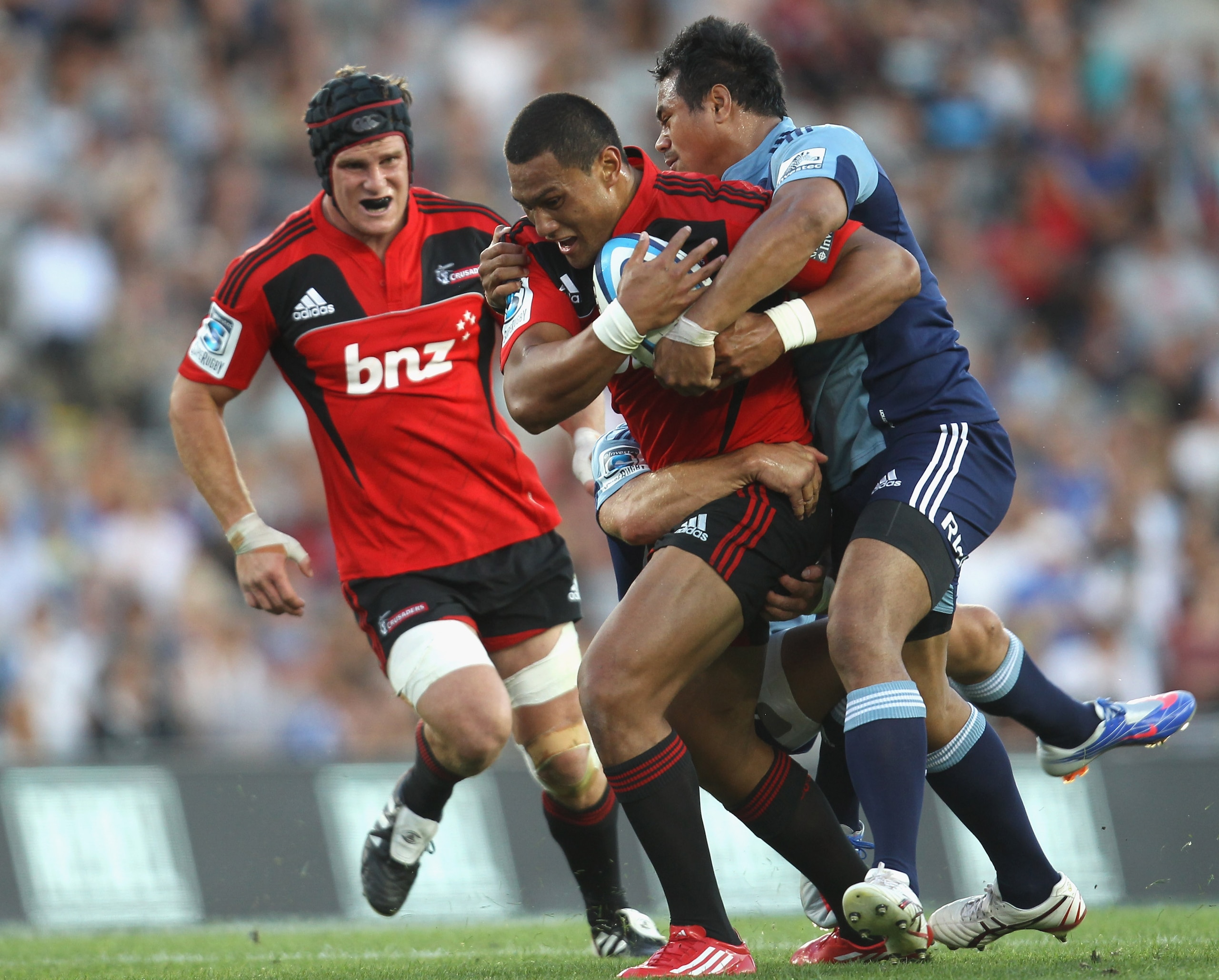 AUCKLAND, NEW ZEALAND - FEBRUARY 19:  Robbie Fruean of the Crusaders  is tackled by Isaia Toeava of the Blues during the round one Super Rugby match between the Blues and the Crusaders at Eden Park on February 19, 2011 in Auckland, New Zealand.  (Photo by