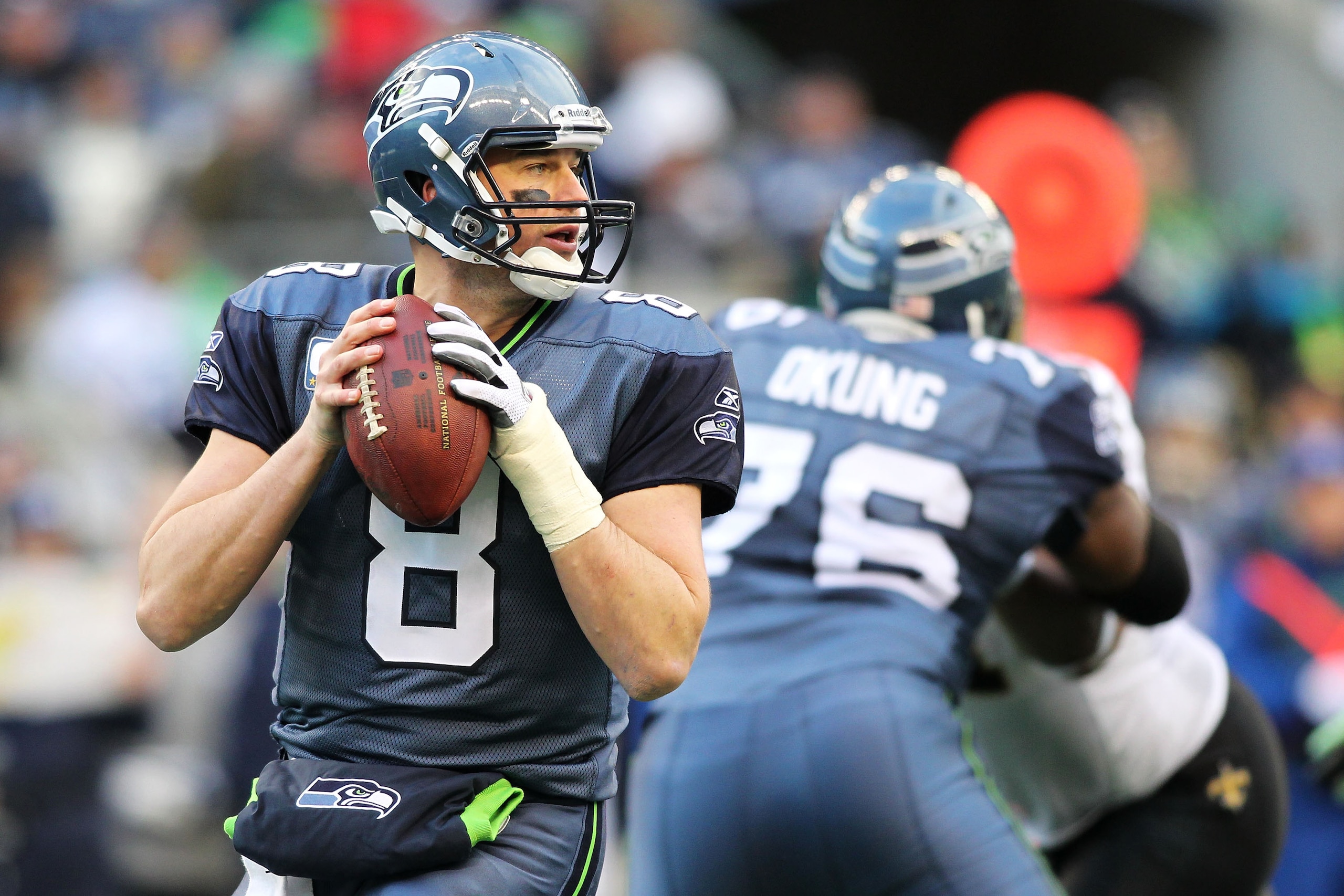 SEATTLE, WA - JANUARY 08:  Matt Hasselbeck #8 of the Seattle Seahawks scrambles against the New Orleans Saints during the 2011 NFC wild-card playoff game at Qwest Field on January 8, 2011 in Seattle, Washington.  (Photo by Jonathan Ferrey/Getty Images)