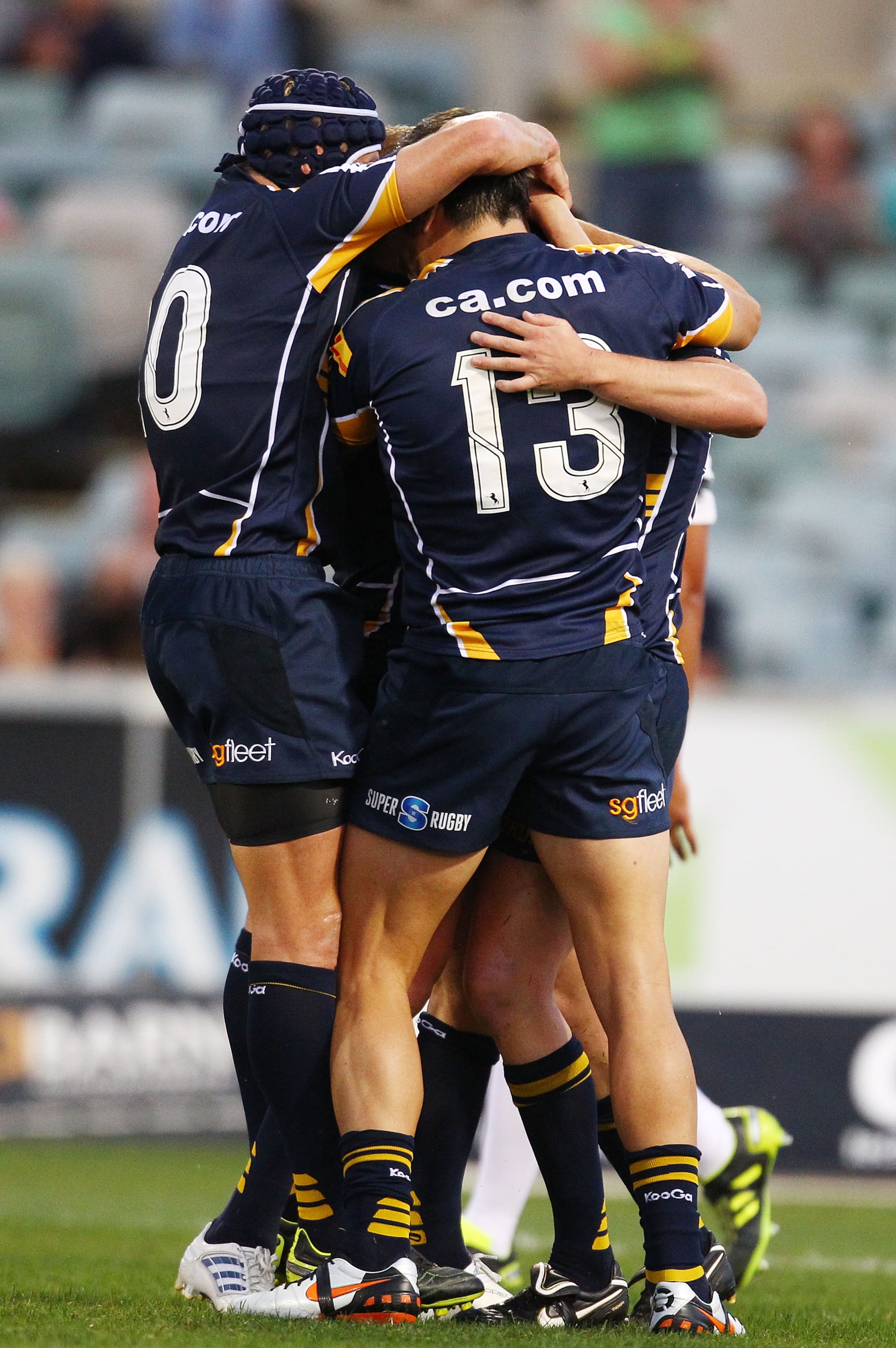 CANBERRA, AUSTRALIA - FEBRUARY 19:  The Brumbies celebrate a try by Robbie Coleman during the round one Super Rugby match between the Brumbies and the Chiefs at Canberra Stadium on February 19, 2011 in Canberra, Australia.  (Photo by Mark Nolan/Getty Imag