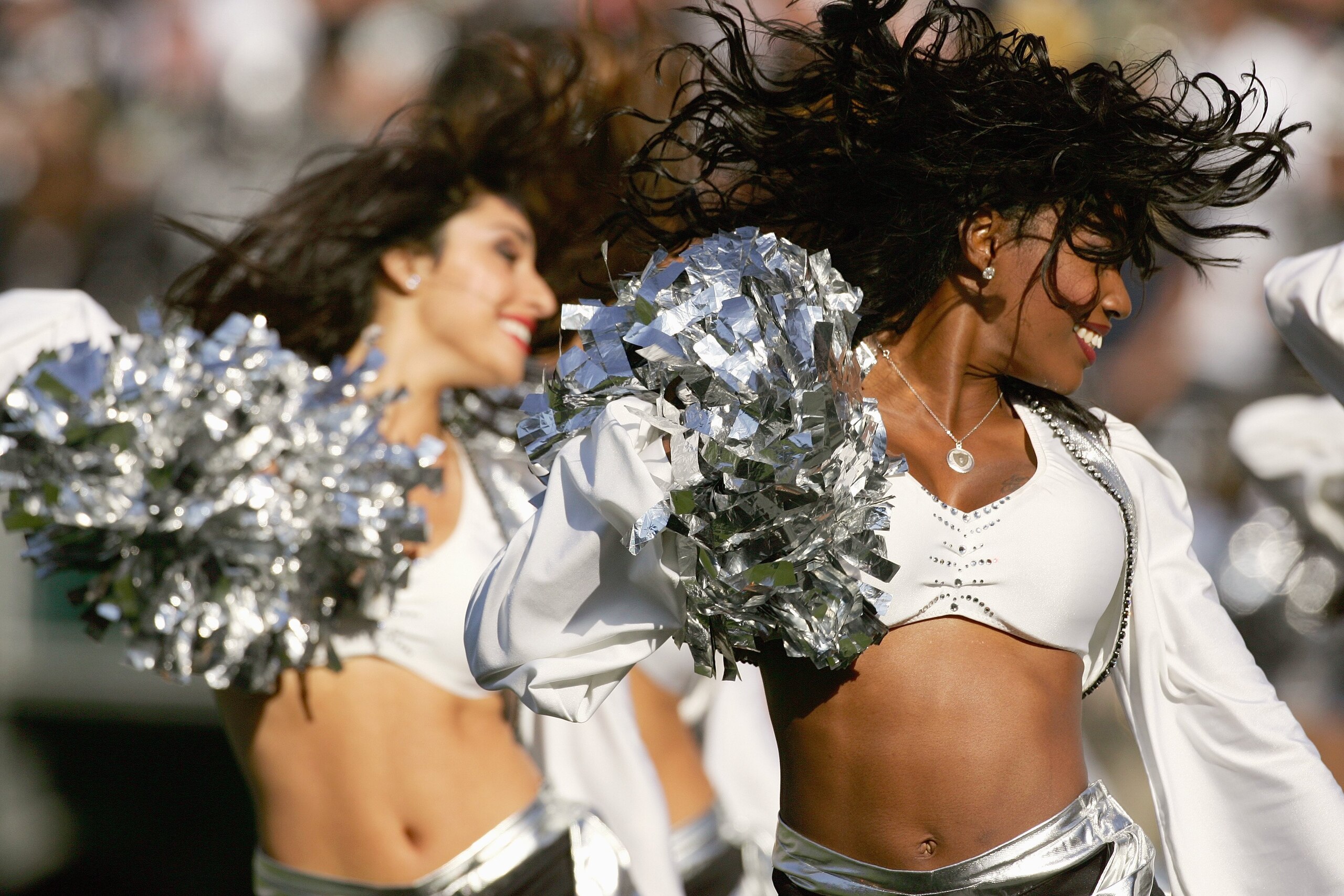 OAKLAND, CA - OCTOBER 29: Oakland Raiderettes Cheerleaders perform on the field during an NFL game between the Oakland Raiders and the Pittsburgh Steelers at McAfee Coliseum on October 29, 2006 in Oakland, California. The Raiders won 20-13. (Photo by Rob OAKLAND, CA - OCTOBER 29: Oakland Raiderettes Cheerleaders perform on the field during an NFL game between the Oakland Raiders and the Pittsburgh Steelers at McAfee Coliseum on October 29, 2006 in Oakland, California. The Raiders won 20-13. (Photo by Rob