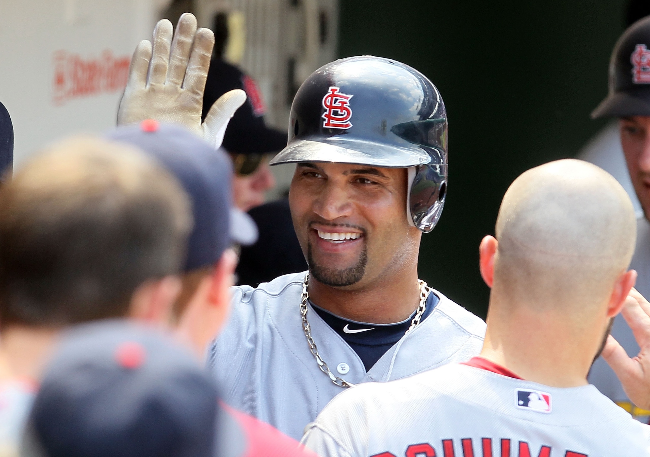 CHICAGO, IL - MAY 30:  Albert Pujols #5 of the St. Louis Cardinals celebrates his fifth inning two run home run against the Chicago Cubs on May 30, 2010 at Wrigley Field in Chicago, Illinois.  (Photo by Jim McIsaac/Getty Images)