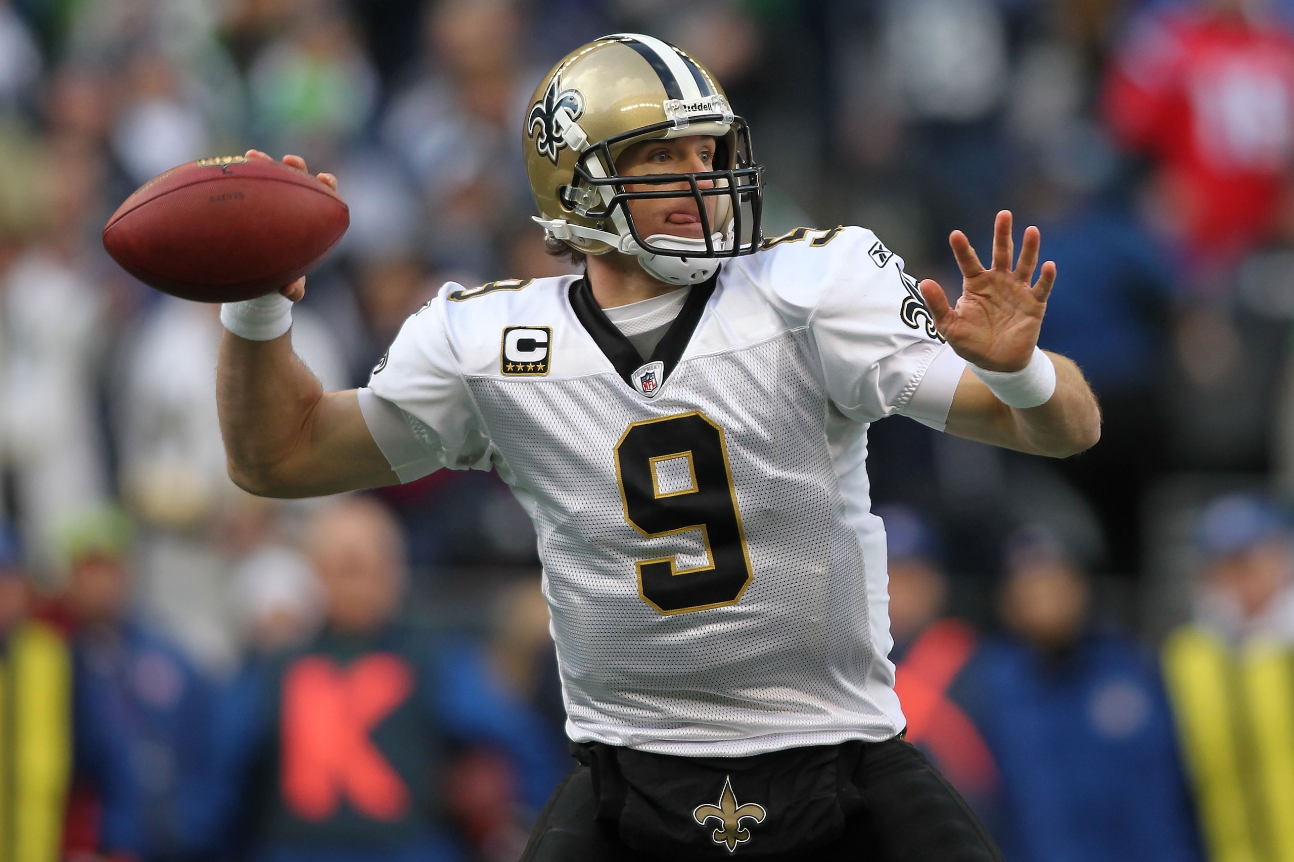 SEATTLE, WA - JANUARY 08:  Quarterback Drew Brees #9 of the New Orleans Saints throws the ball in the second quarter against the Seattle Seahawks during the 2011 NFC wild-card playoff game at Qwest Field on January 8, 2011 in Seattle, Washington.  (Photo