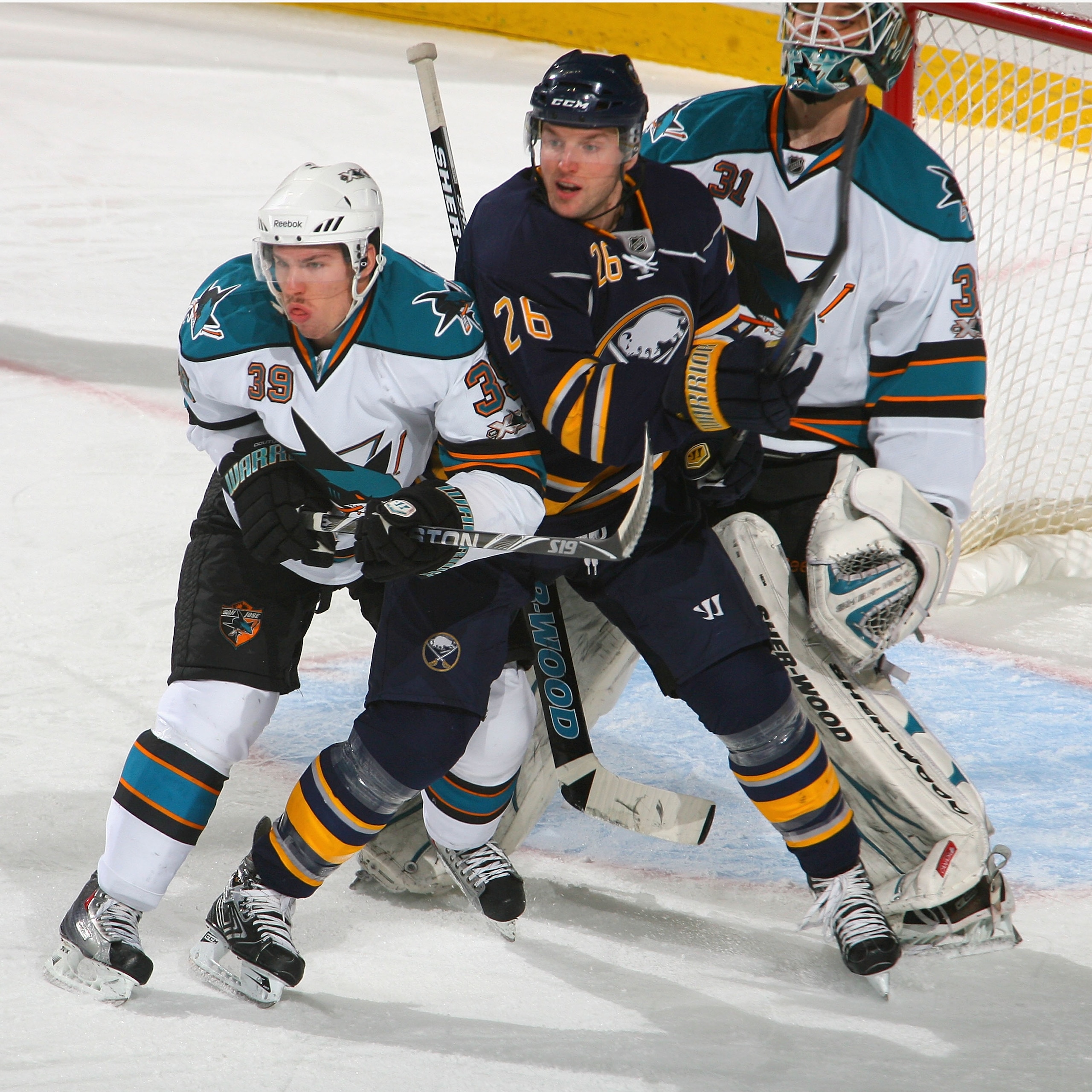 BUFFALO, NY - DECEMBER 09: Logan Couture #39 and Antii Niemi #31 of the San Jose Sharks defend against Thomas Vanek #26 of the Buffalo Sabres at HSBC Arena on December 9, 2010 in Buffalo, New York.  (Photo by Rick Stewart/Getty Images)
