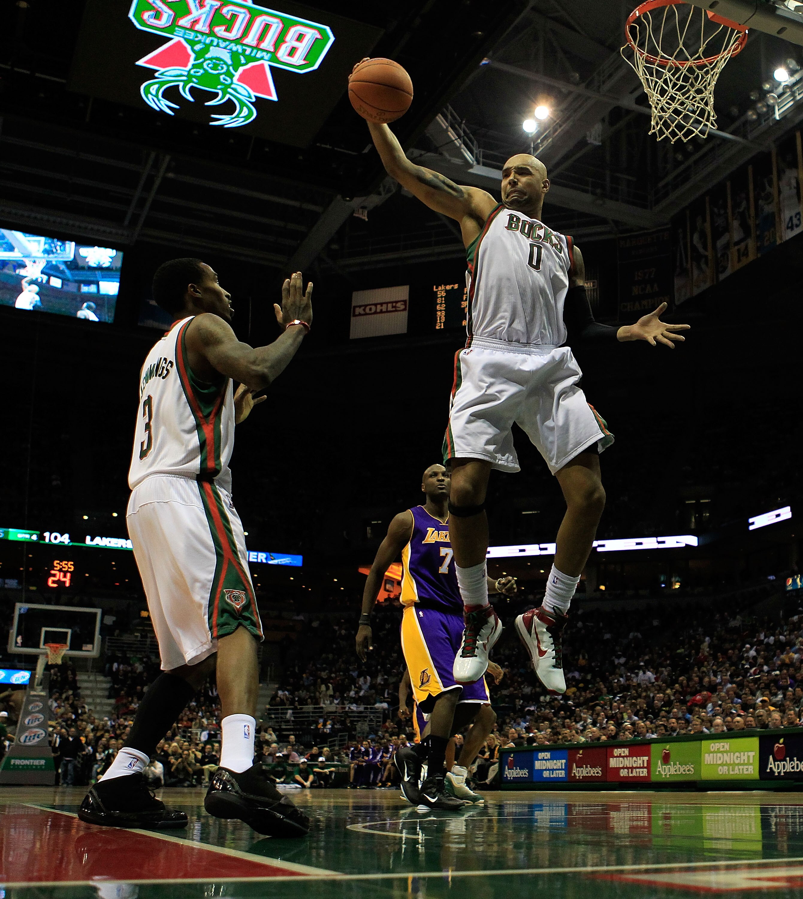 MILWAUKEE - NOVEMBER 16: Drew Gooden #0 of the Milwaukee Bucks grabs a rebound next to teammate Brandon Jennings #3 against the Los Angeles Lakers at the Bradley Center on November 16, 2010 in Milwaukee, Wisconsin. The Lakers defeated the Bucks 118-107. N