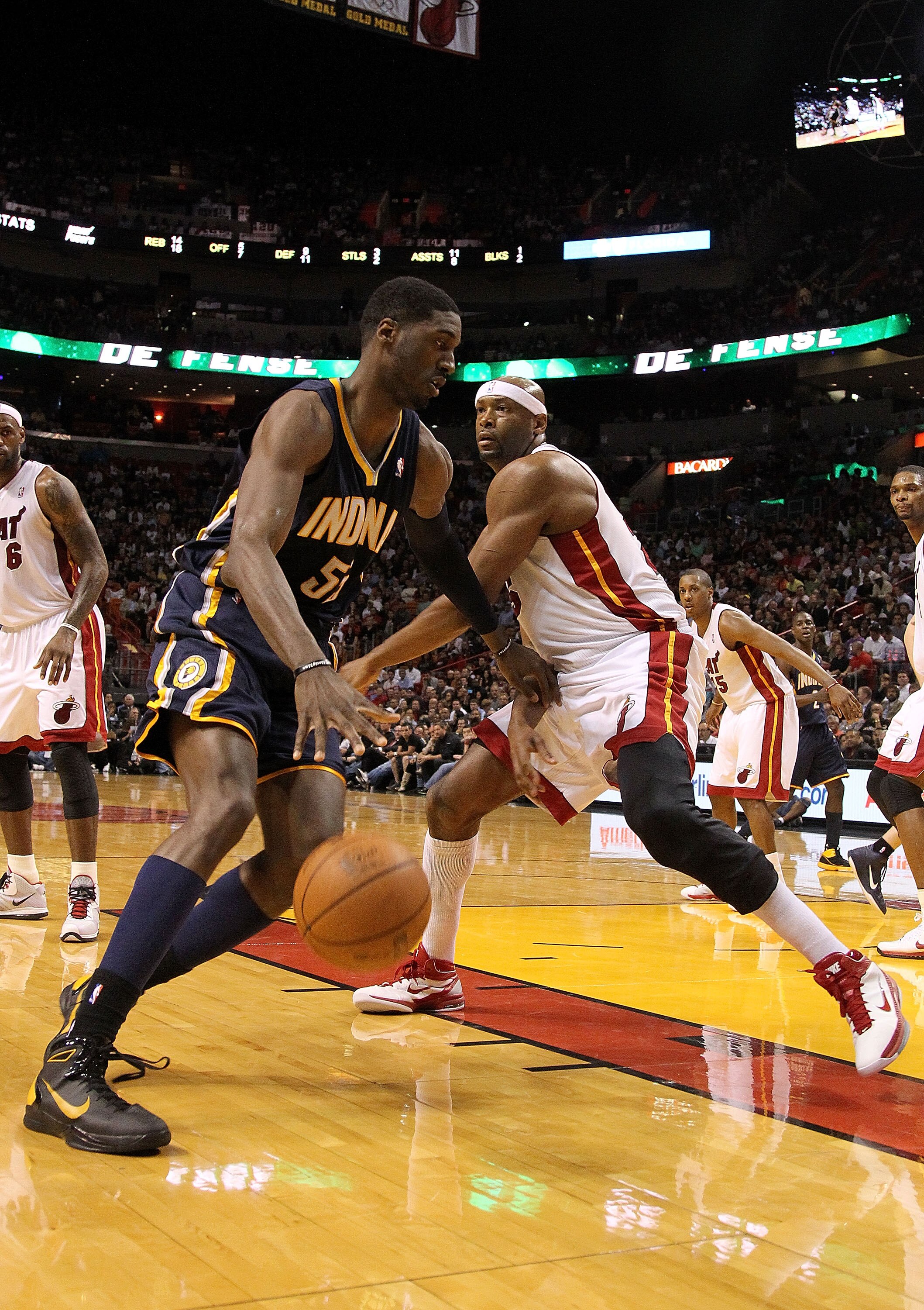 MIAMI, FL - FEBRUARY 08:  Roy Hibbert #55 of the Indiana Pacers drives around Eric Dampier #25 of the Miami Heat during a game at American Airlines Arena on February 8, 2011 in Miami, Florida. NOTE TO USER: User expressly acknowledges and agrees that, by