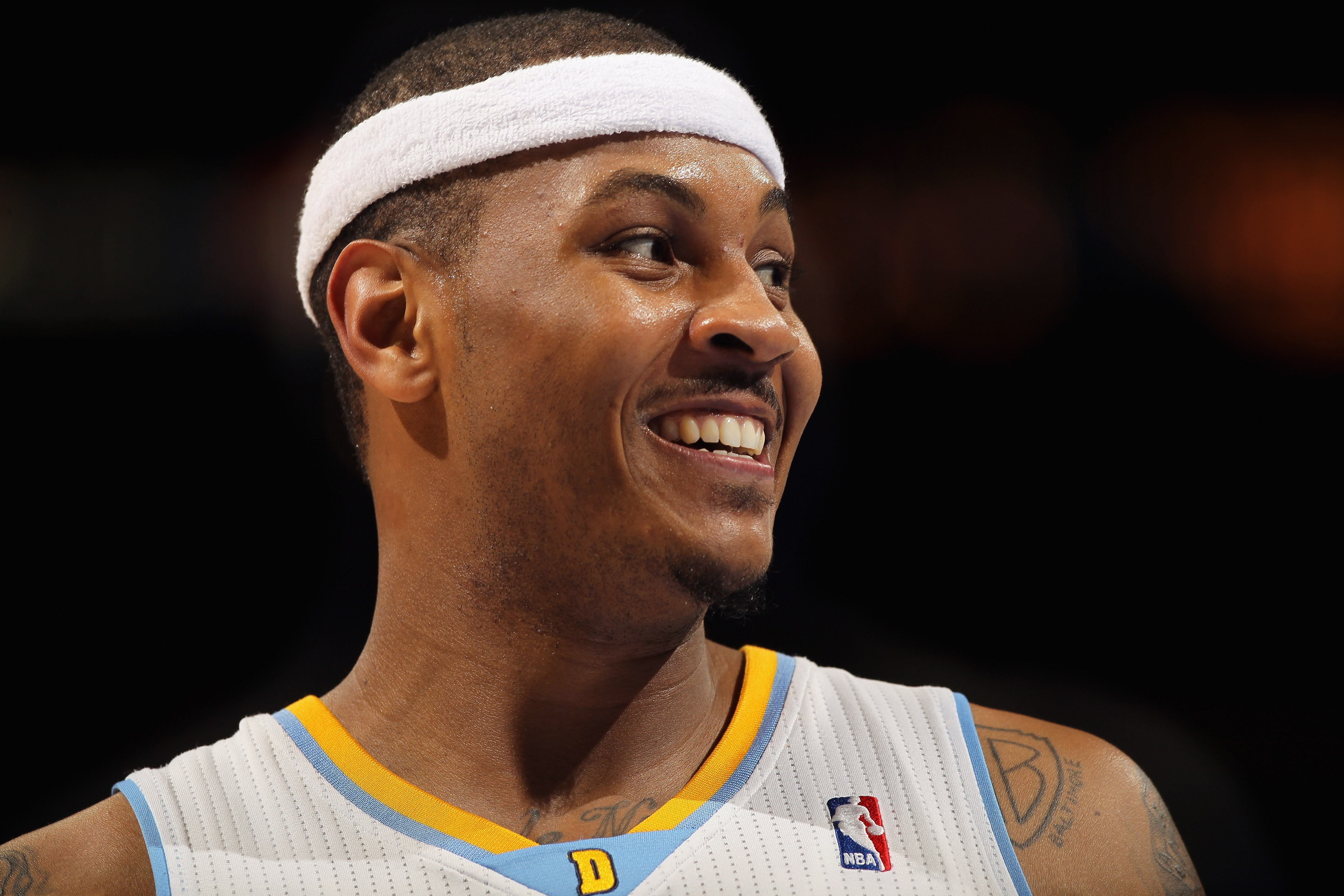 DENVER, CO - FEBRUARY 10:  Carmelo Anthony #15 of the Denver Nuggets looks on during a break in the action against the Dallas Mavericks during NBA action at the Pepsi Center on February 10, 2011 in Denver, Colorado. The Nuggets defeated the Mavericks 121-