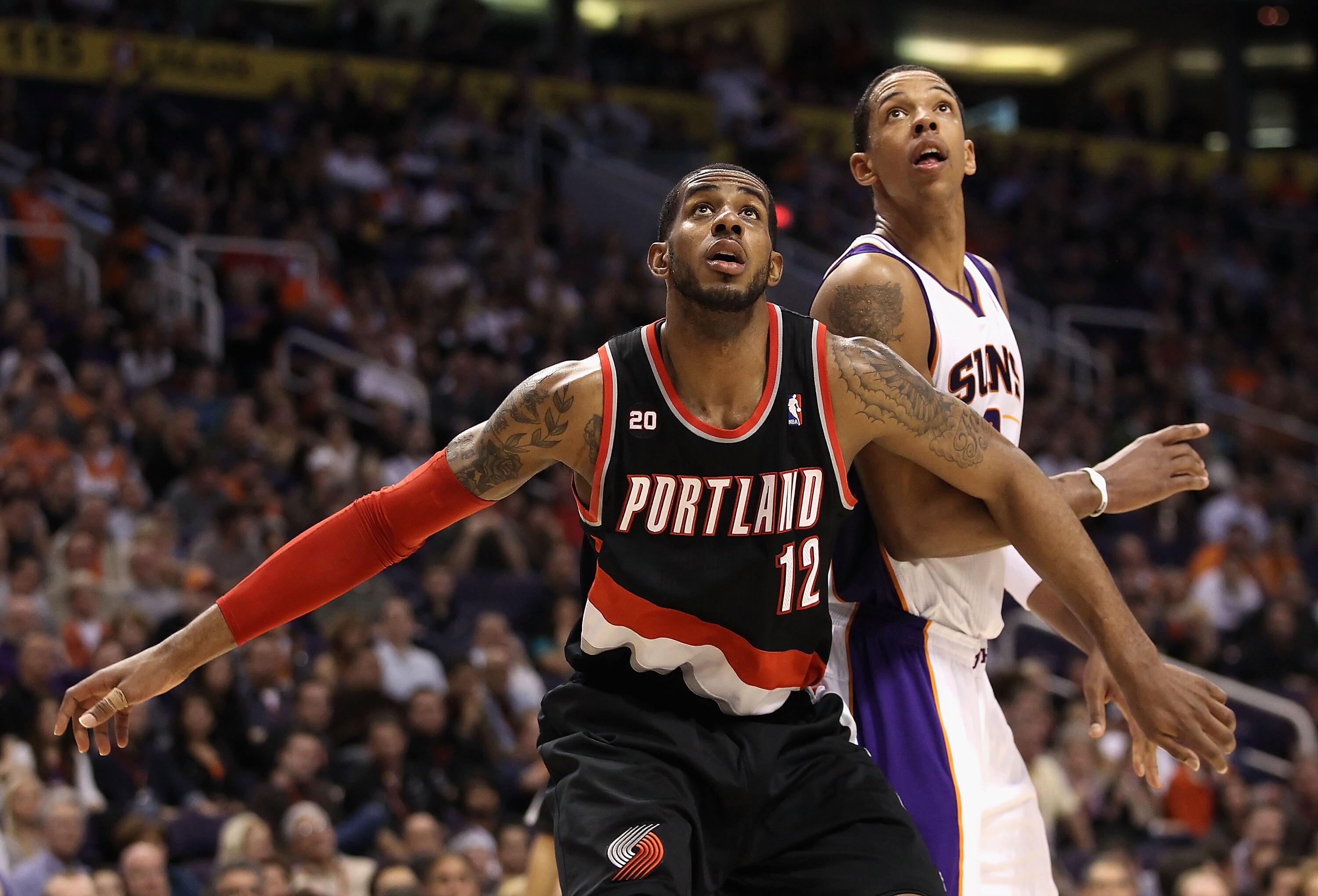 PHOENIX, AZ - JANUARY 14:  LaMarcus Aldridge #12 of the Portland Trail Blazers blocks out Channing Frye #8 of the Phoenix Suns during the NBA game at US Airways Center on January 14, 2011 in Phoenix, Arizona.  The Suns defeated the Trail Blazers 115-111.