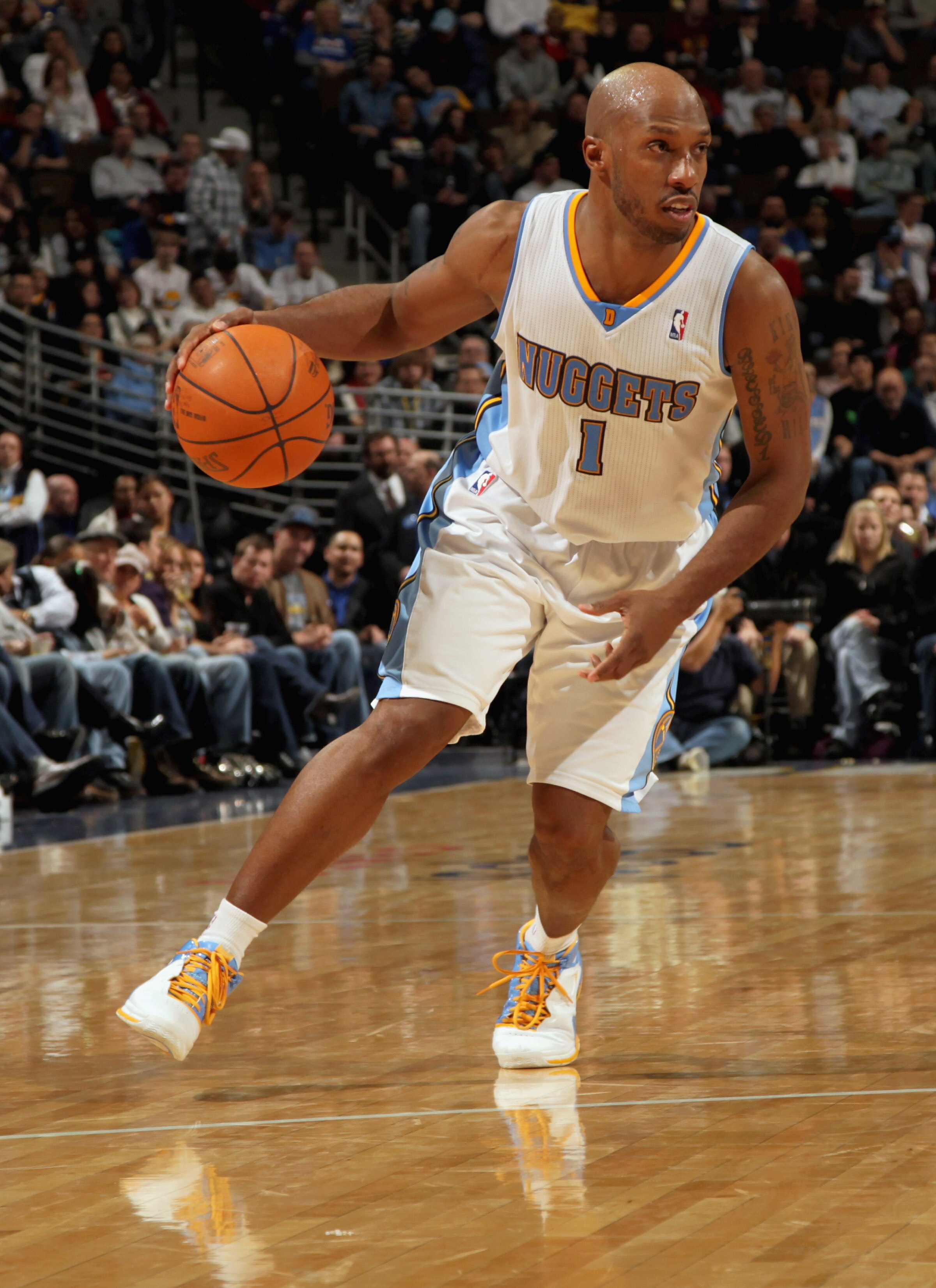DENVER, CO - FEBRUARY 10:  Chauncey Billups #1 of the Denver Nuggets dribbles the ball against the Dallas Mavericks during NBA action at the Pepsi Center on February 10, 2011 in Denver, Colorado. The Nuggets defeated the Mavericks 121-120. NOTE TO USER: U