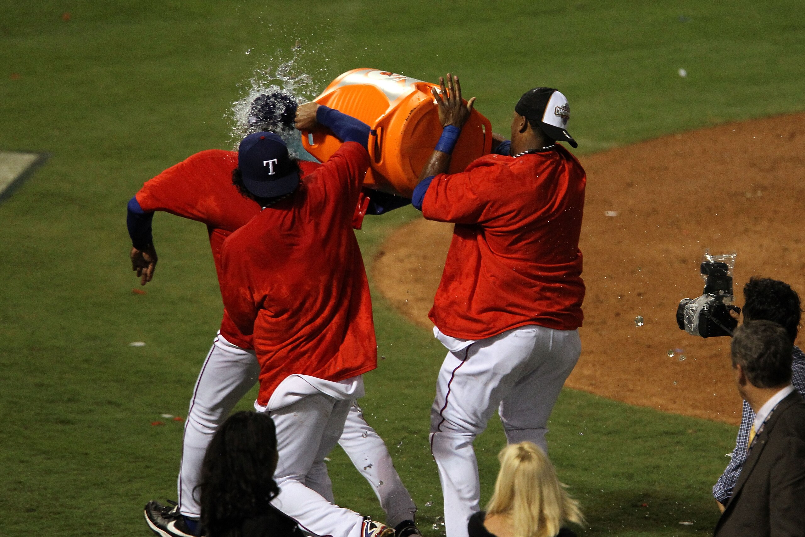ARLINGTON, TX - OCTOBER 22:  Manager Ron Washington of the Texas Rangers has a gatorade cooler dumped on him after the Rangers defeated the New York Yankees in Game Six of the ALCS to advance to the World Series during the 2010 MLB Playoffs at Rangers Bal