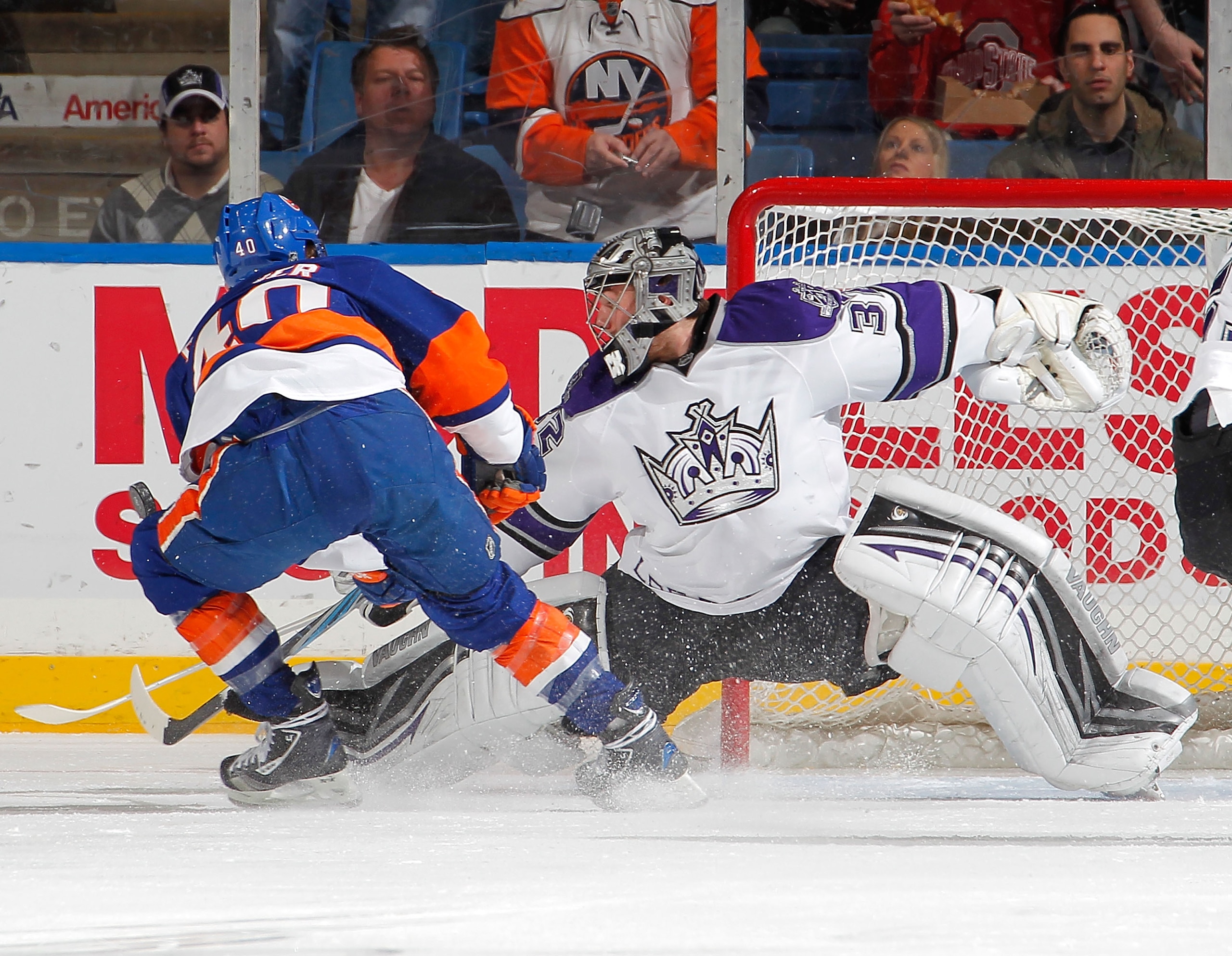 UNIONDALE, NY - FEBRUARY 19: Goalie Jonathan Quick #32 of the Los Angeles Kings makes a save on a breakaway by Michael Grabner #40 of the New York Islanders during the first period of an NHL hockey game at the Nassau Coliseum on February 19, 2011 in Union