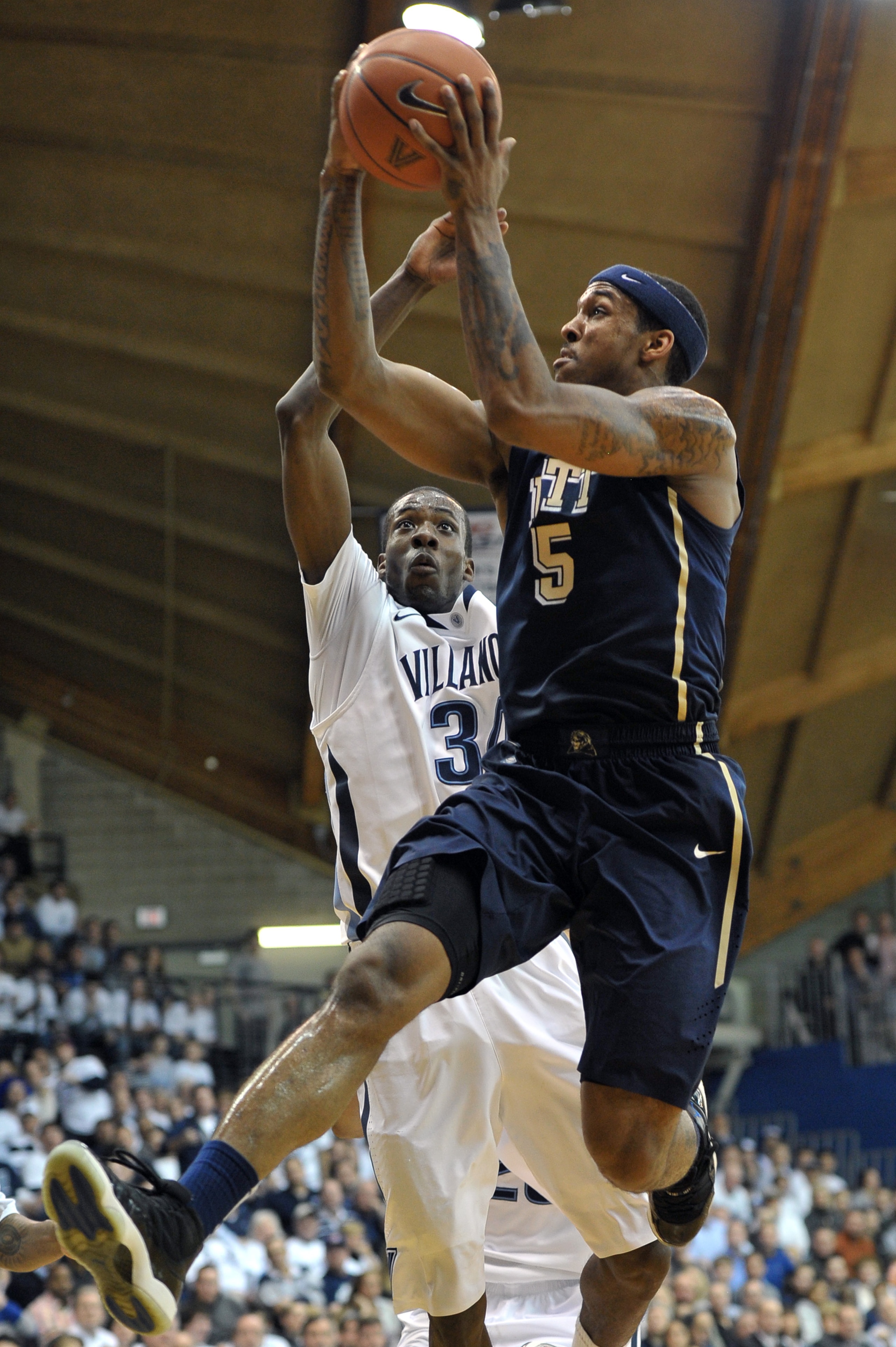 VILLANOVA, PA - FEBRUARY 12: Gilbert Brown #5 of the Pittsburgh Panthers lays up a shot past Isaiah Armwood #34 of the Villanova Wildcats at The Pavilion on February 12, 2011 in Villanova, Pennsylvania (Photo by Drew Hallowell/Getty Images) VILLANOVA, PA - FEBRUARY 12: Gilbert Brown #5 of the Pittsburgh Panthers lays up a shot past Isaiah Armwood #34 of the Villanova Wildcats at The Pavilion on February 12, 2011 in Villanova, Pennsylvania (Photo by Drew Hallowell/Getty Images)