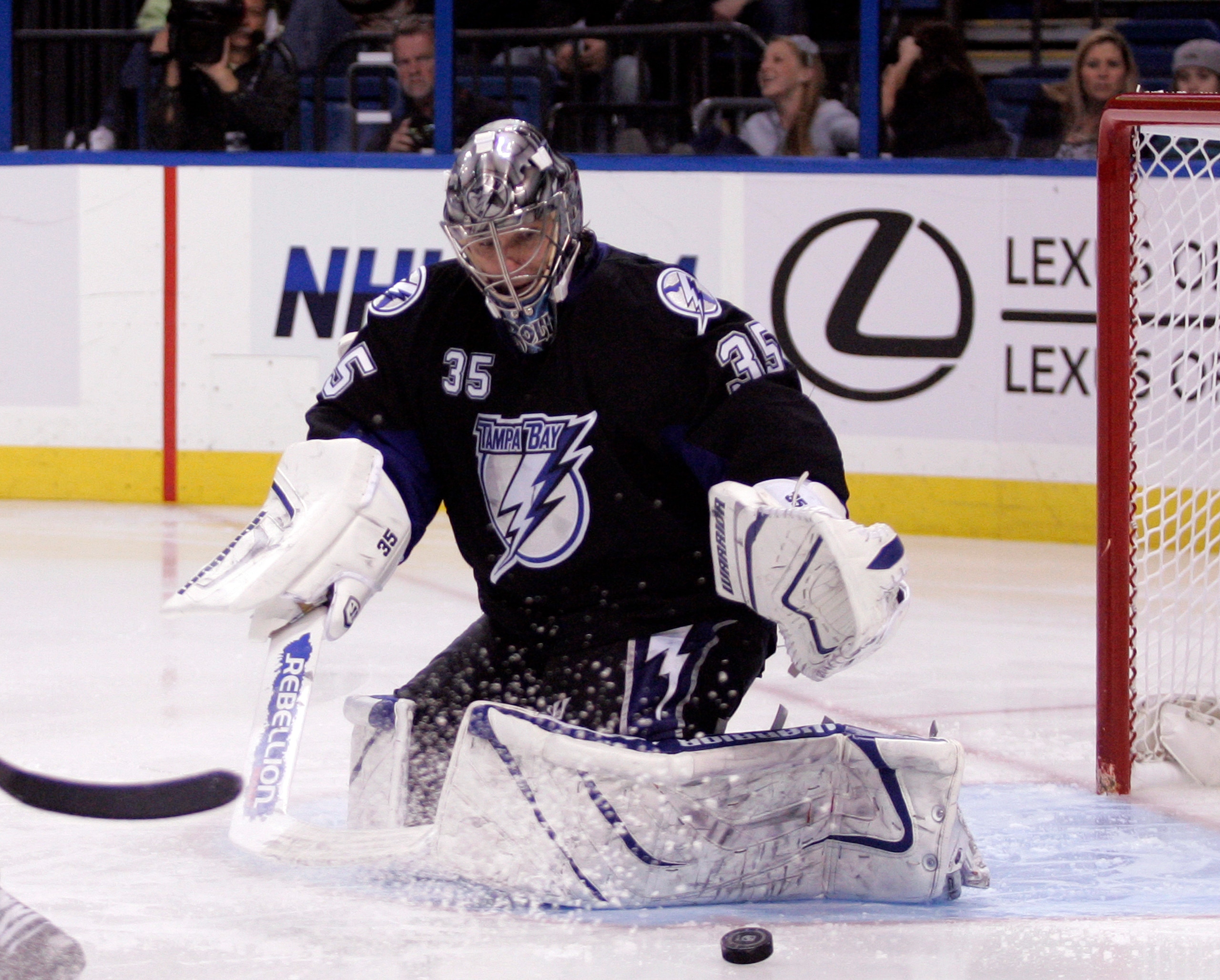 TAMPA, FL - JANUARY 25: Dwayne Roloson #35 of the Tampa Bay Lightning makes a save against the Toronto Maple Leafs at St. Pete Times Forum on January 25, 2011 in Tampa, Florida. The Lightning defeated the Leafs 2-0. (Photo by Justin K. Aller/Getty Images)