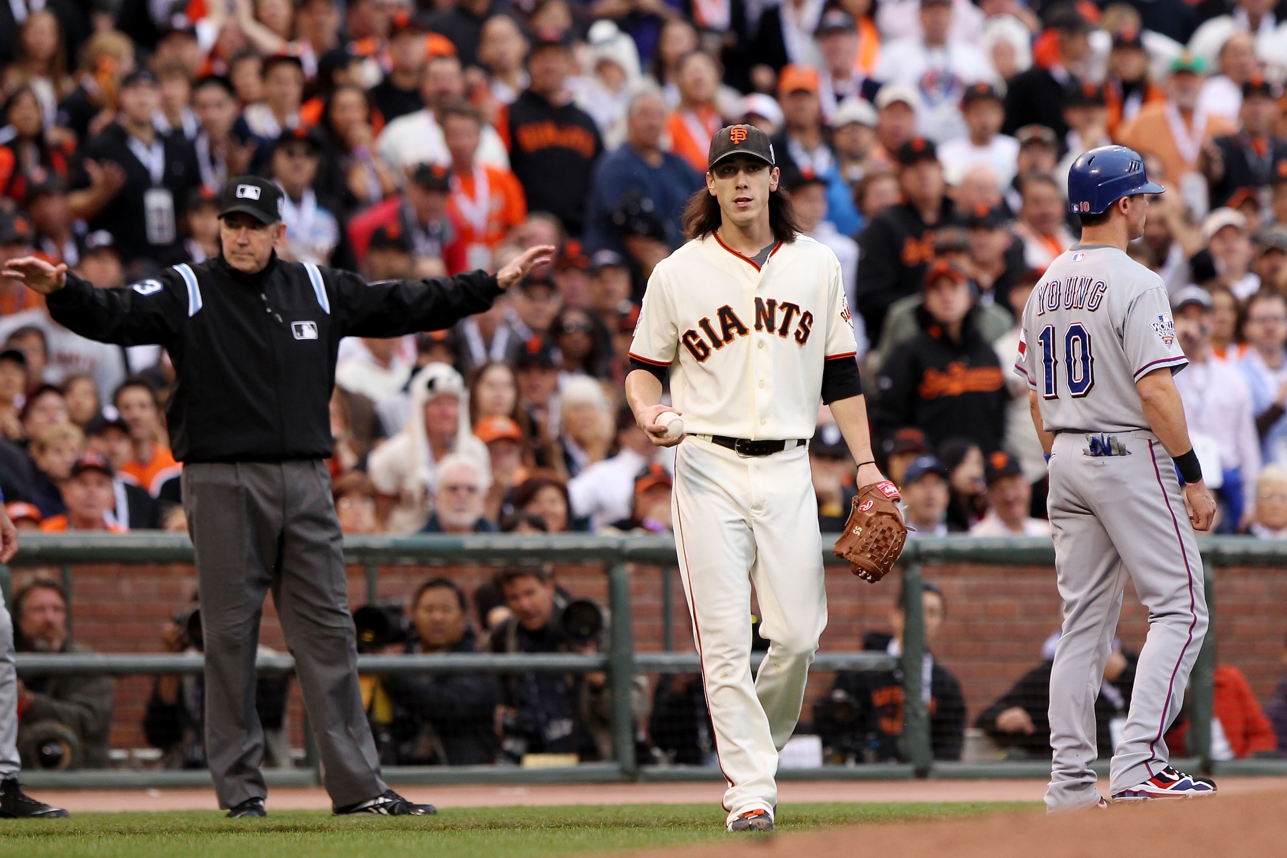 SAN FRANCISCO - OCTOBER 27:  Tim Lincecum #55 of the San Francisco Giants looks on after failing to tag out Michael Young #10 of the Texas Rangers in Game One of the 2010 MLB World Series at AT&T Park on October 27, 2010 in San Francisco, California.  (Ph