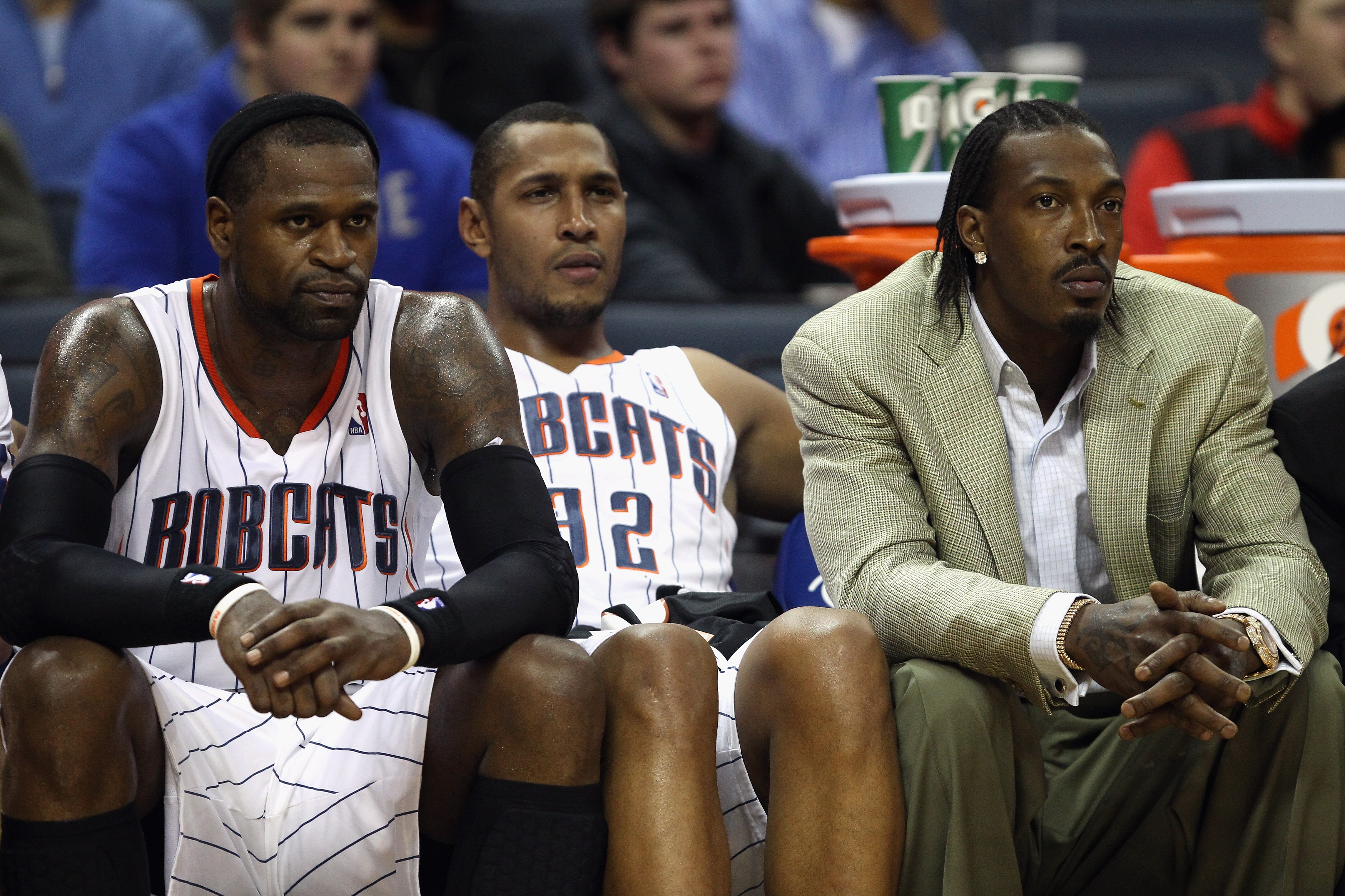 CHARLOTTE, NC - DECEMBER 21:  Teammates Stephen Jackson #1, Boris Diaw #32 and Gerald Wallace #3 of the Charlotte Bobcats sit on the bench during their 99-81 loss to the Oklahoma City Thunder at Time Warner Cable Arena on December 21, 2010 in Charlotte, N