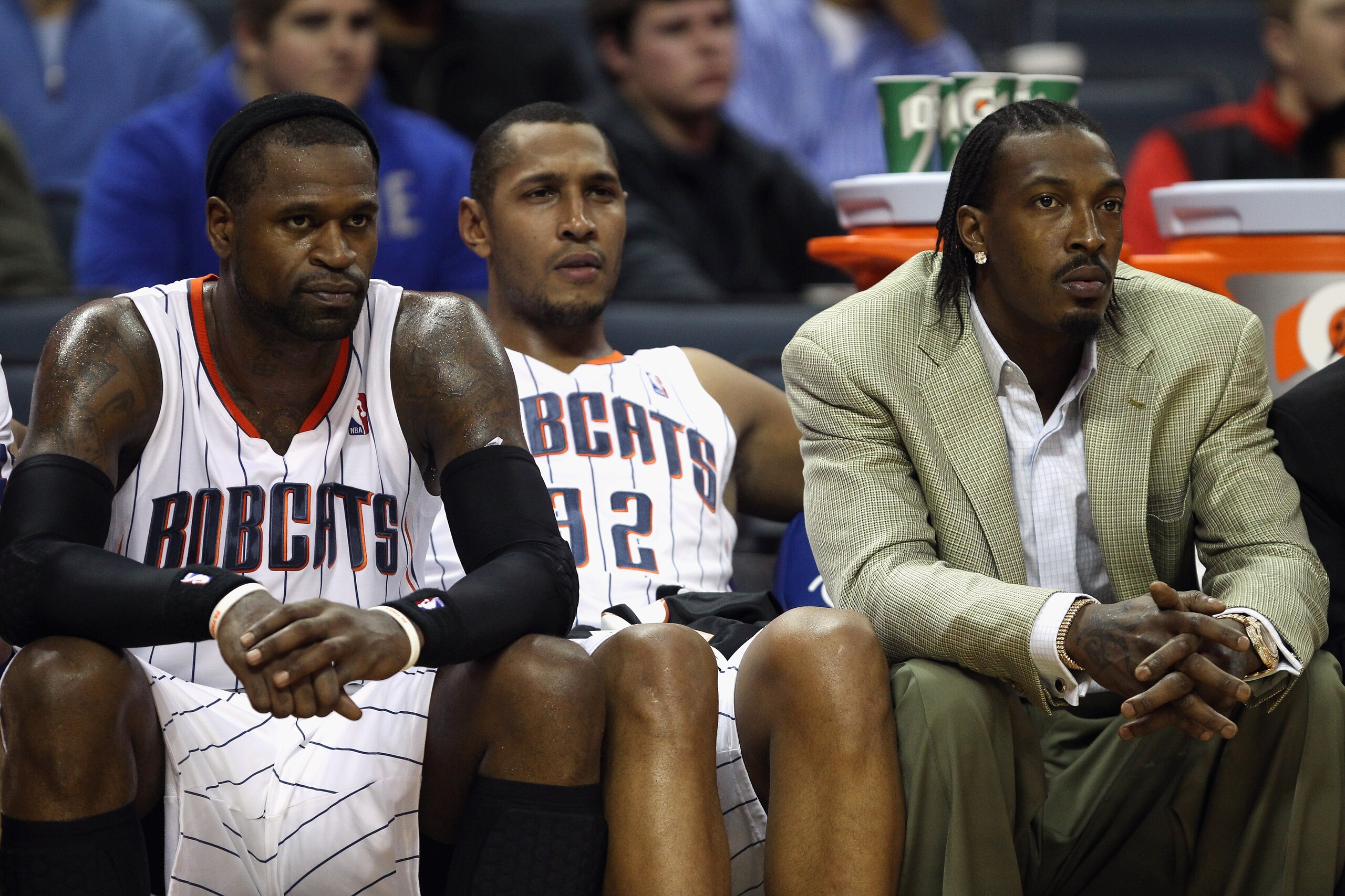 CHARLOTTE, NC - DECEMBER 21:  Teammates Stephen Jackson #1, Boris Diaw #32 and Gerald Wallace #3 of the Charlotte Bobcats sit on the bench during their 99-81 loss to the Oklahoma City Thunder at Time Warner Cable Arena on December 21, 2010 in Charlotte, N