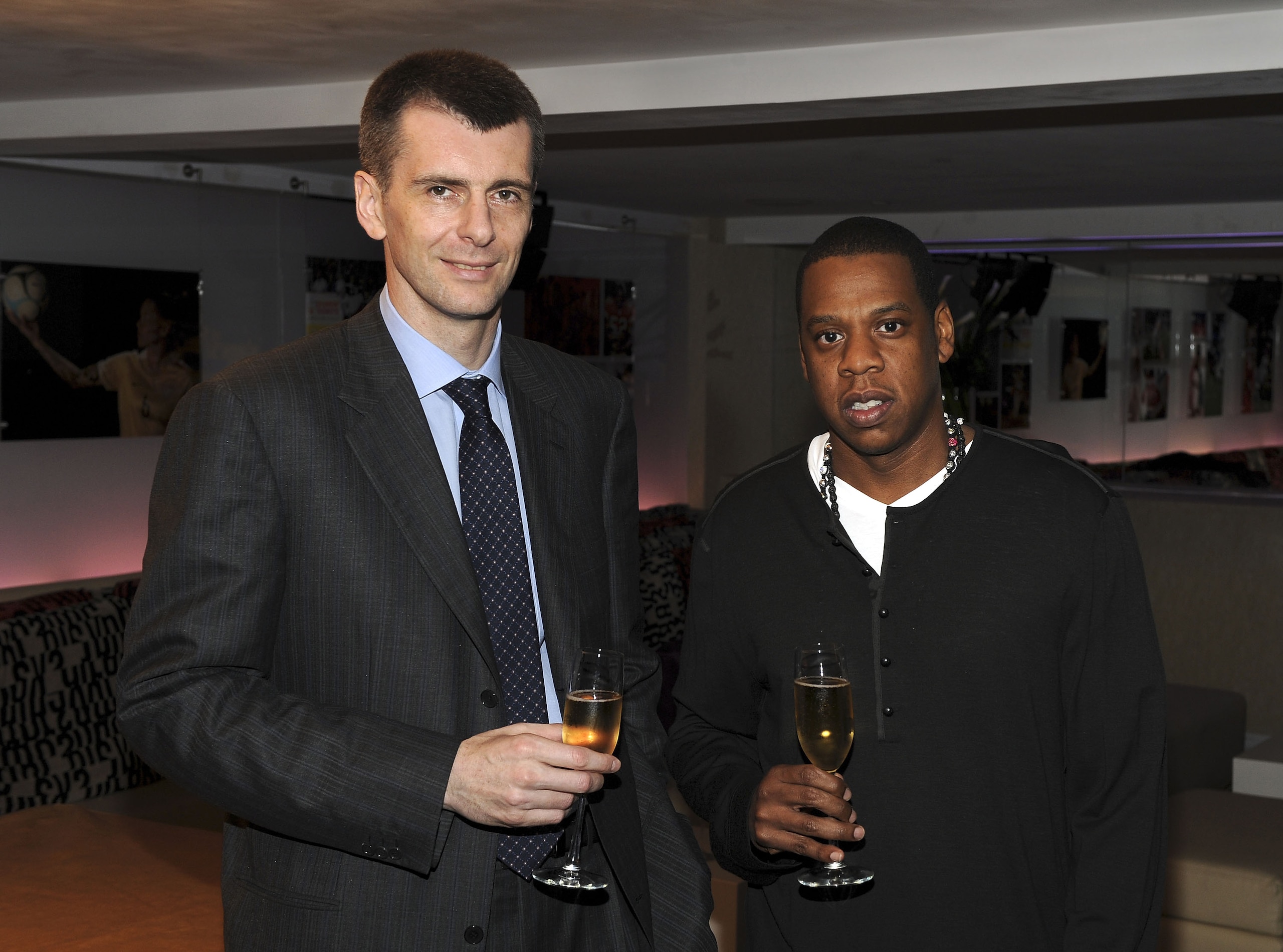 NEW YORK - MAY 18:  (EXCLUSIVE) Nets owner Mikhail Prokhorov with cultural icon and Nets investor JAY-Z celebrate Prokhorov's purchase of the team at lunch today at JAY-Z's 40/40 club on May 18, 2010 in New York City. Prokhorov is representing the Nets to