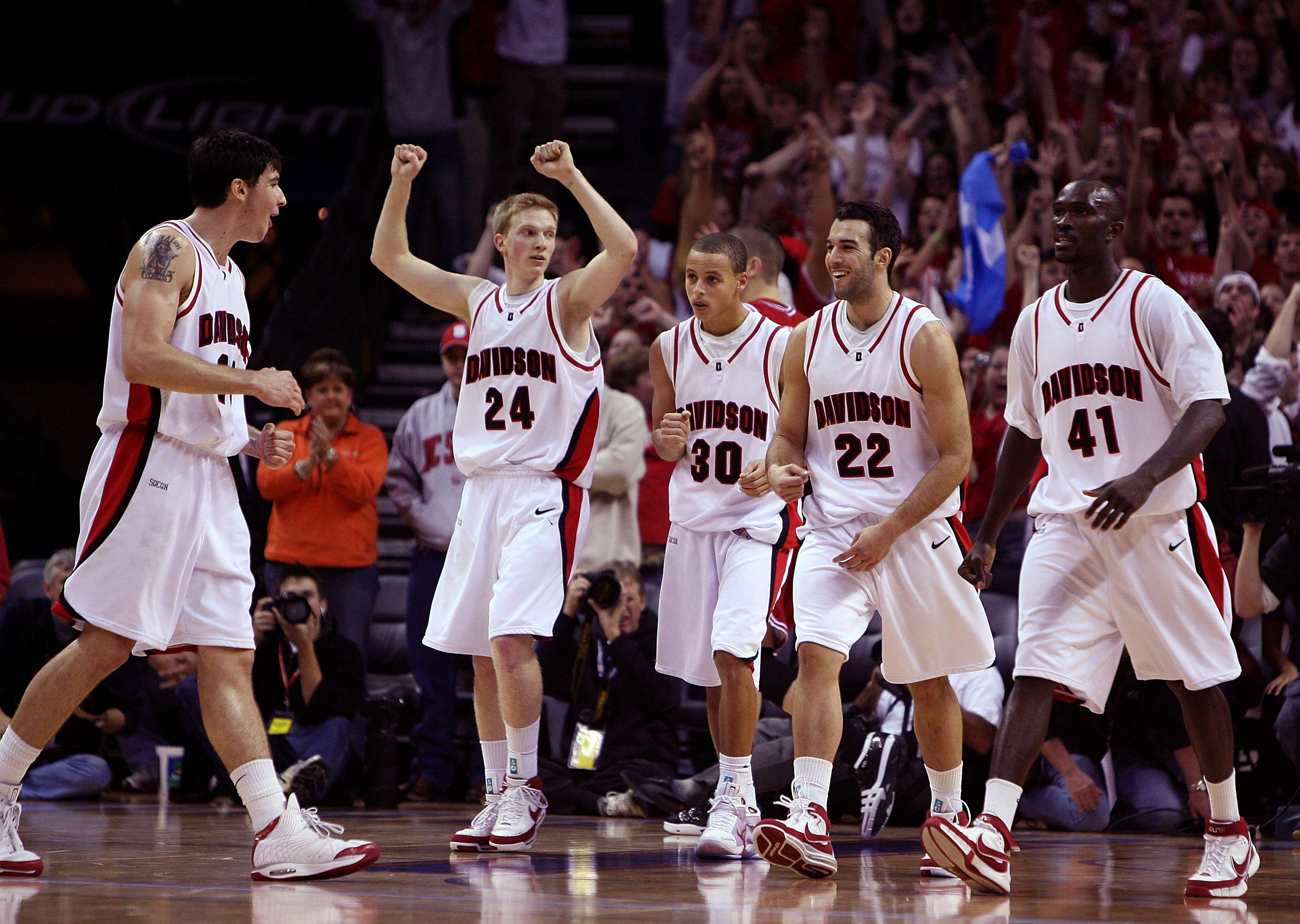 CHARLOTTE, NC - DECEMBER 06:  The Davidson Wildcats react to their 72-67 victory over the North Carolina State Wolfpack after their game at Time Warner Cable Arena on December 6, 2008 in Charlotte, North Carolina.  (Photo by Streeter Lecka/Getty Images)