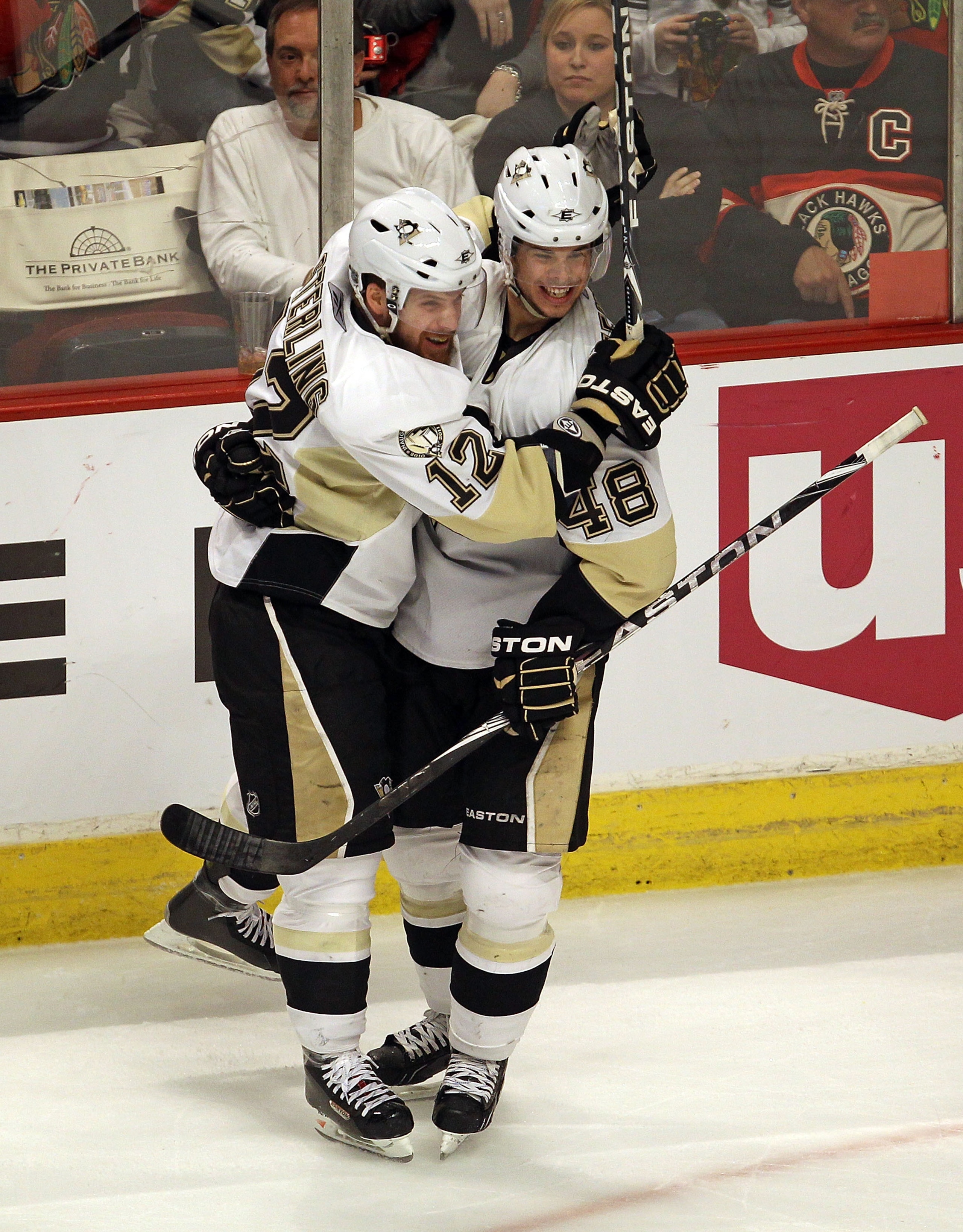 CHICAGO, IL - FEBRUARY 20: Brett Sterling #12 of the Pittsburgh Penguins celebrates a game-tying goal in the 3rd period with teammate Tyler Kennedy #48 against the Chicago Blackhawks at the United Center on February 20, 2011 in Chicago, Illinois. The Blac