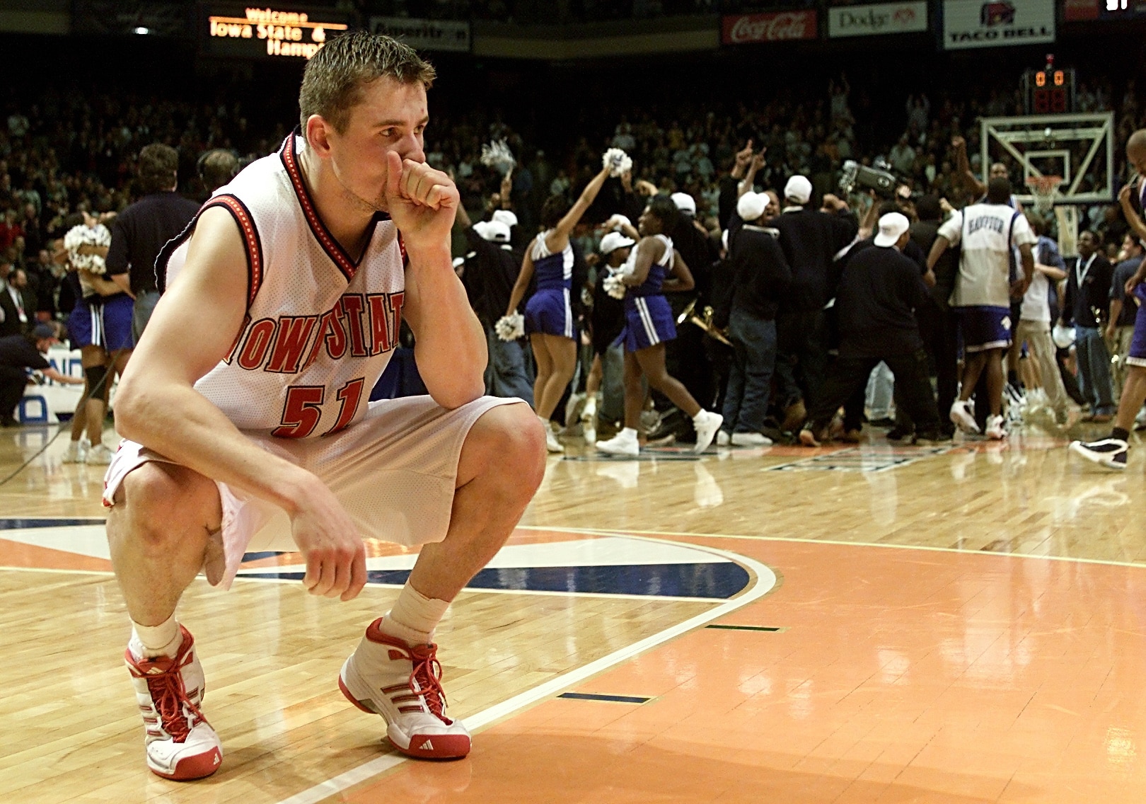 15 Mar 2001: Forward Martin Rancik #51 of the Iowa State Cyclones ponders losing as the Hampton Pirates celebrate during the first round of the NCAA Tournament at the Boise State University Pavilion in Boise, Idaho. The Pirates upset the Cyclones 58-57.