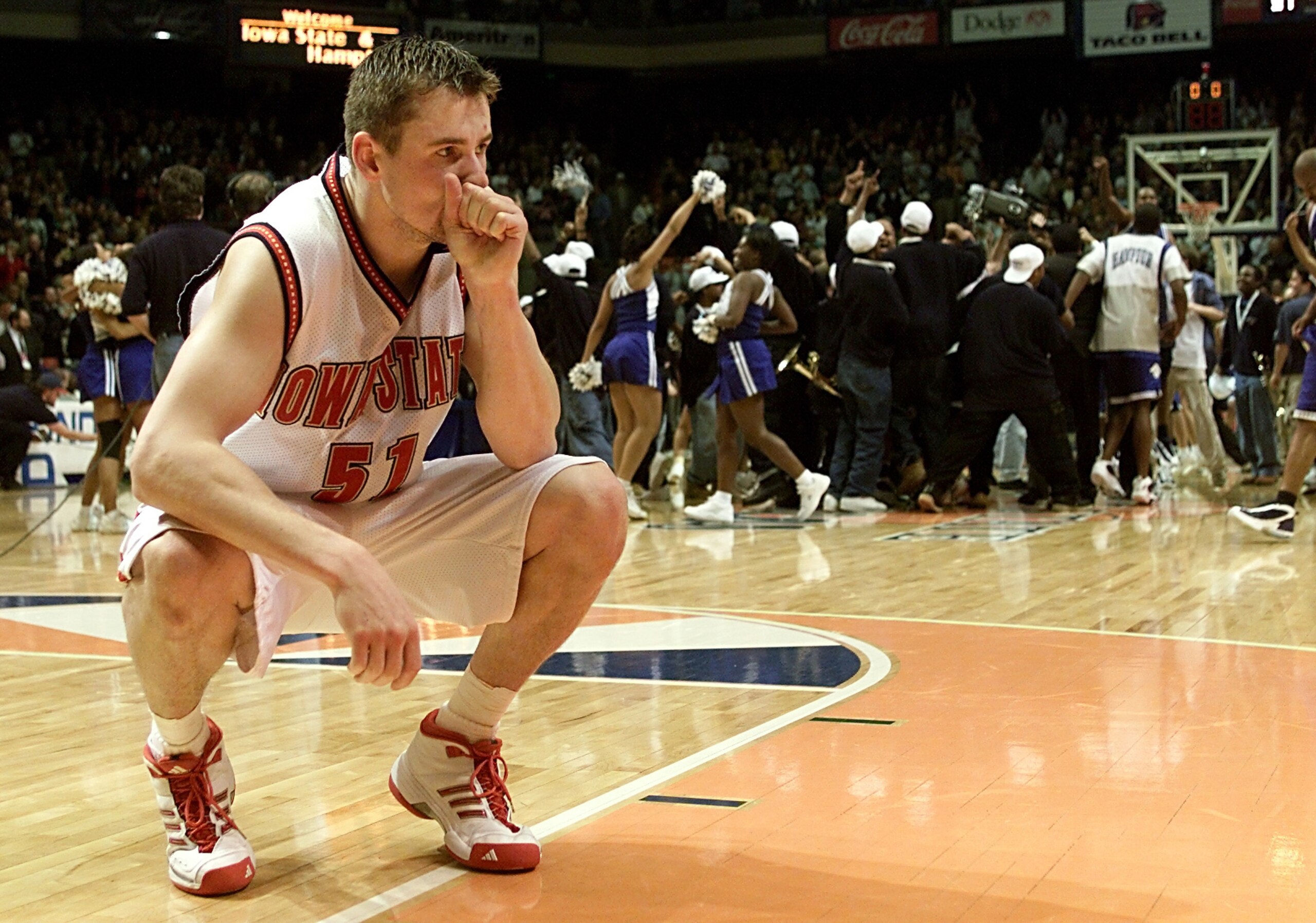 15 Mar 2001:  Forward Martin Rancik #51 of the Iowa State Cyclones ponders losing as the Hampton Pirates celebrate during the first round of the NCAA Tournament at the Boise State University Pavilion in Boise, Idaho. The Pirates upset the Cyclones 58-57.