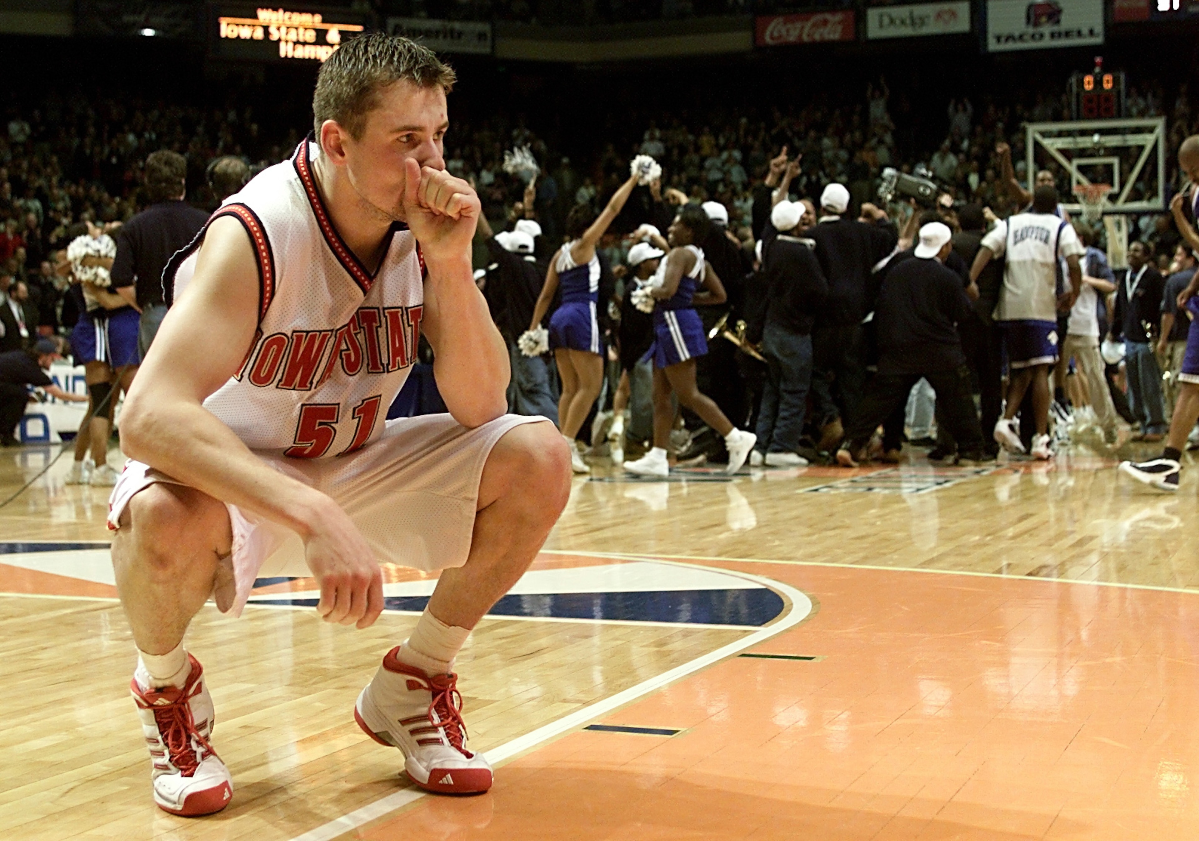 15 Mar 2001:  Forward Martin Rancik #51 of the Iowa State Cyclones ponders losing as the Hampton Pirates celebrate during the first round of the NCAA Tournament at the Boise State University Pavilion in Boise, Idaho. The Pirates upset the Cyclones 58-57.