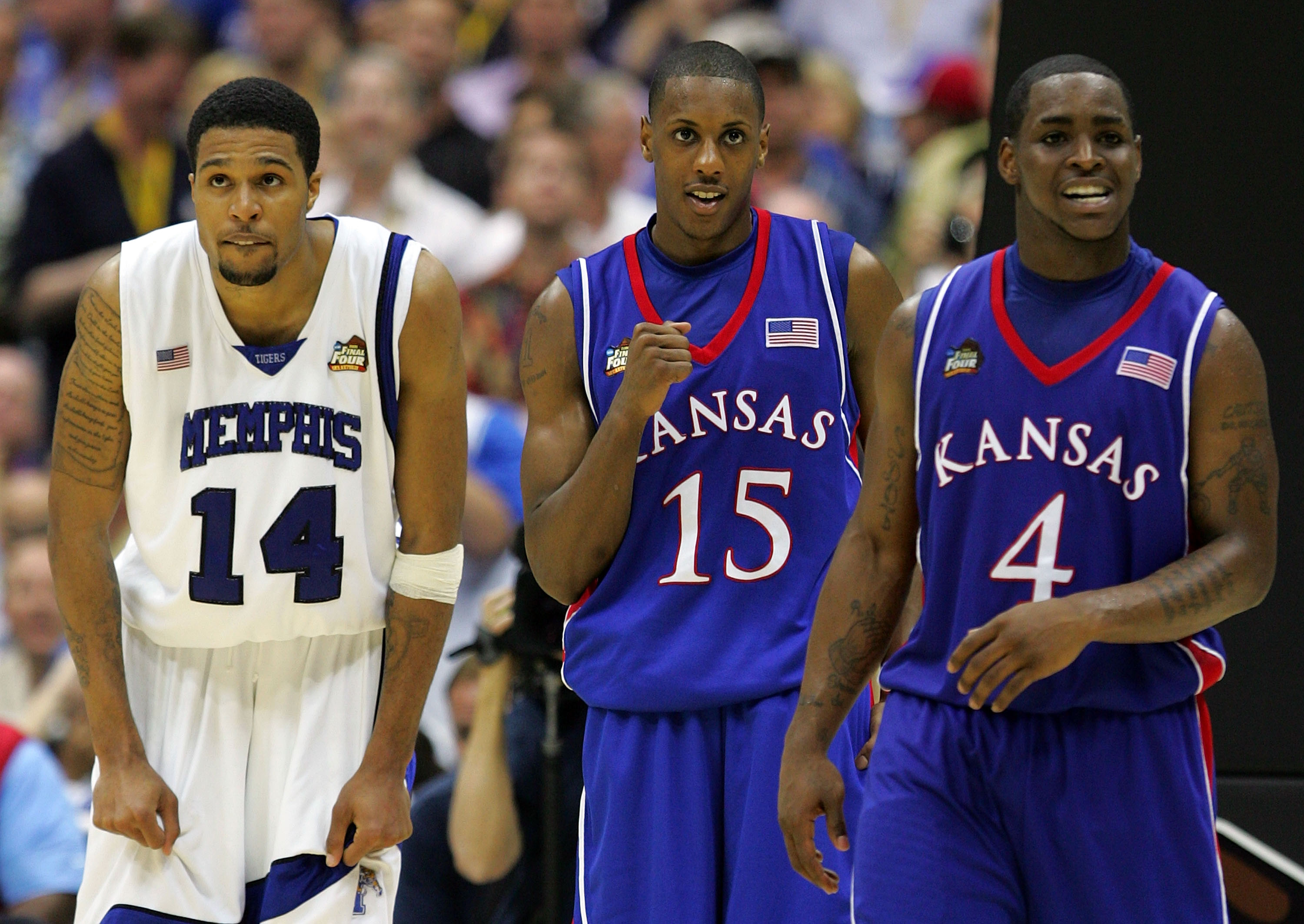SAN ANTONIO - APRIL 07:  Mario Chalmers #15 of the Kansas Jayhawks reacts in overtime along with teammate Sherron Collins #4 as Chris Douglas-Roberts #14 of the Memphis Tigers looks on during the 2008 NCAA Men's National Championship game at the Alamodome
