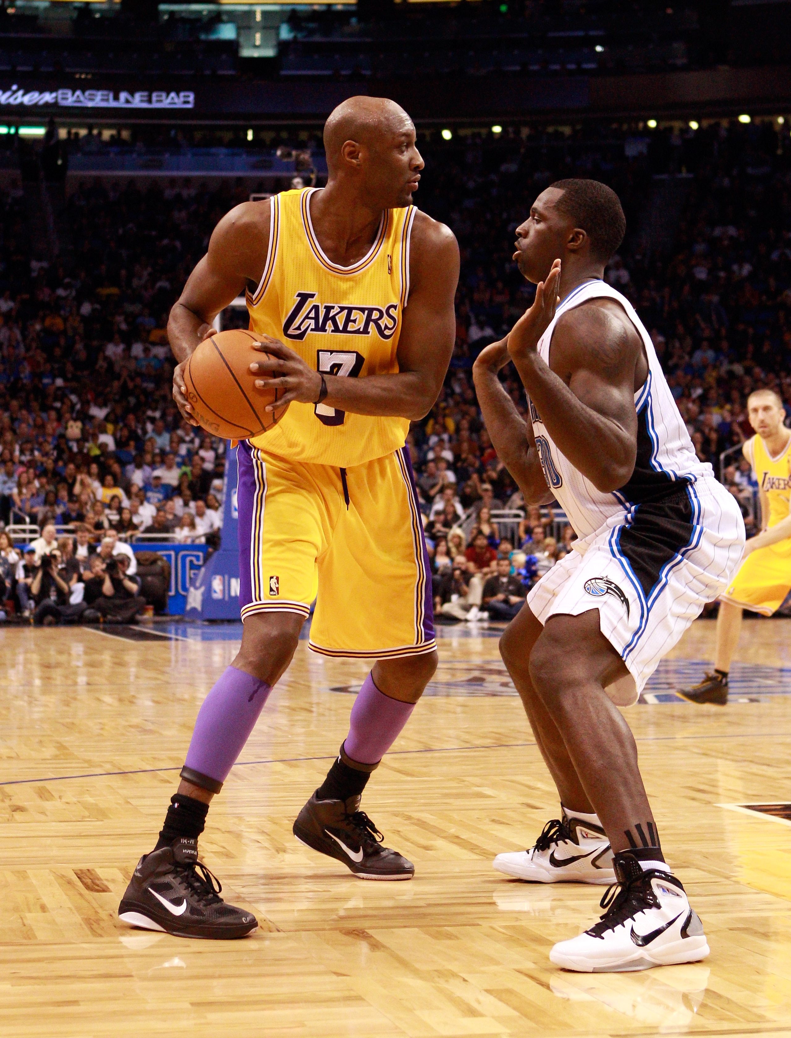 ORLANDO, FL - FEBRUARY 13: Lamar Odom #7 of the Los Angeles Lakers is guarded by Brandon Bass #30 of the Orlando Magic during the game at Amway Arena on February 13, 2011 in Orlando, Florida. NOTE TO USER: User expressly acknowledges and agrees that, by ORLANDO, FL - FEBRUARY 13: Lamar Odom #7 of the Los Angeles Lakers is guarded by Brandon Bass #30 of the Orlando Magic during the game at Amway Arena on February 13, 2011 in Orlando, Florida. NOTE TO USER: User expressly acknowledges and agrees that, by