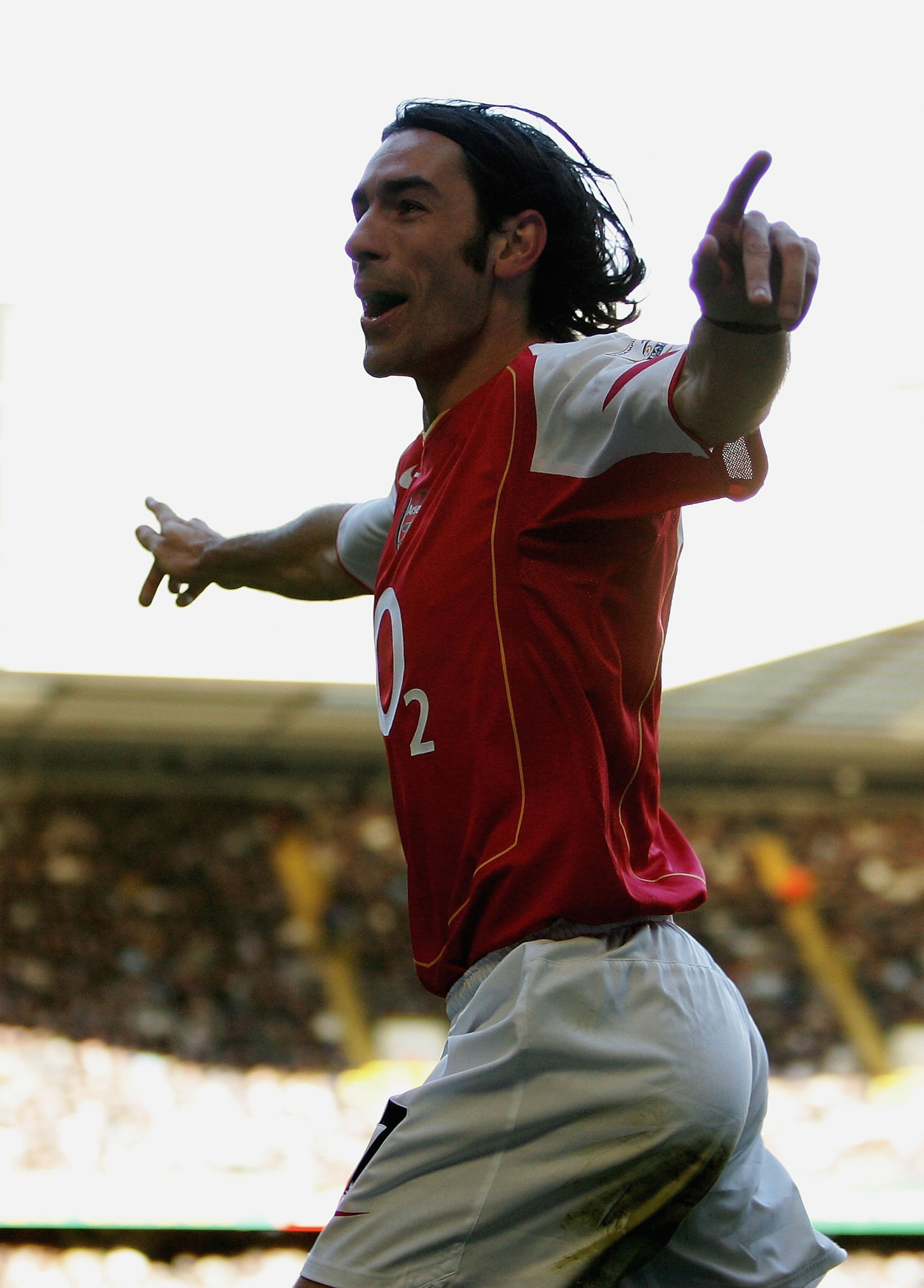 LONDON - NOVEMBER 13:  Robert Pires of Arsenal celebrates his goal during the Barclays Premiership match between Tottenham Hotspur and Arsenal at White Hart Lane on November 13, 2004 in London, England.  (Photo by Ian Walton/Getty Images)