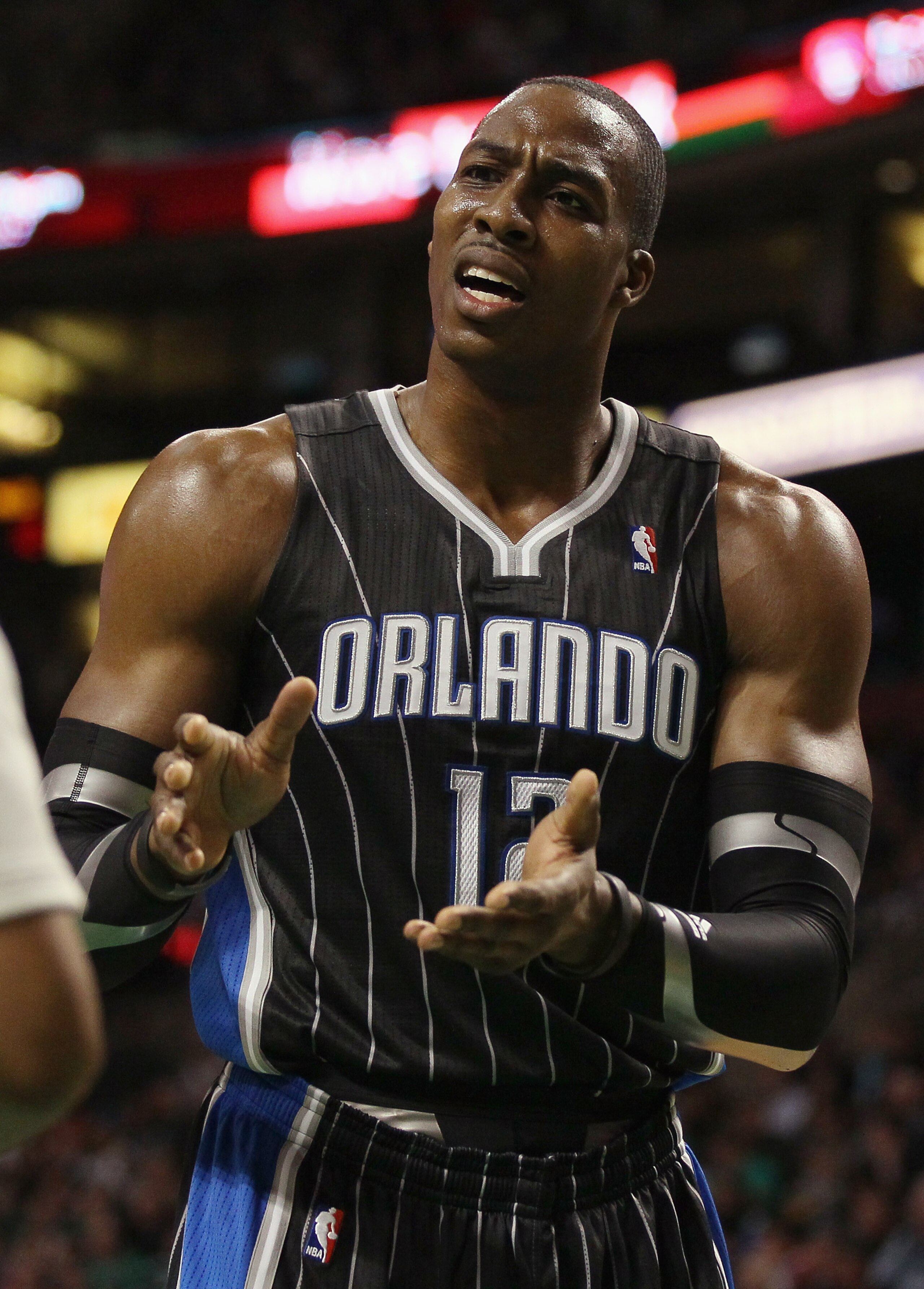 BOSTON, MA - JANUARY 17: Dwight Howard #12 of the Orlando Magic reacts to a call in the first quarter as they take on the Boston Celtics on January 17, 2011 at the TD Garden in Boston, Massachusetts. NOTE TO USER: User expressly acknowledges and agrees BOSTON, MA - JANUARY 17: Dwight Howard #12 of the Orlando Magic reacts to a call in the first quarter as they take on the Boston Celtics on January 17, 2011 at the TD Garden in Boston, Massachusetts. NOTE TO USER: User expressly acknowledges and agrees