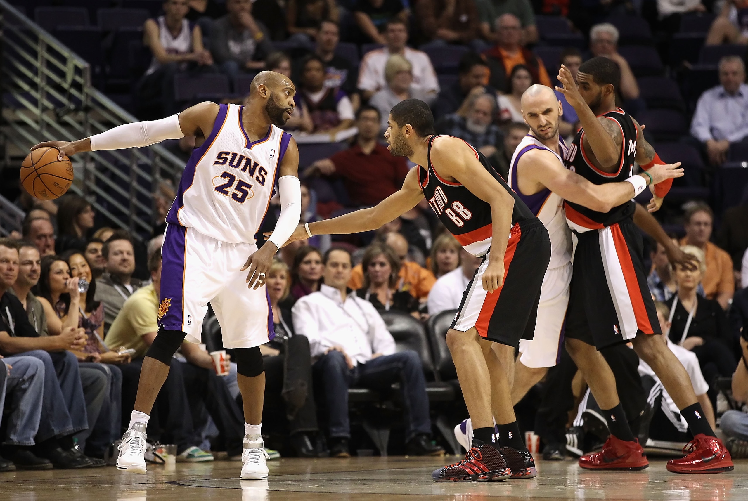 PHOENIX, AZ - JANUARY 14: Vince Carter #25 of the Phoenix Suns handles the ball under pressure from Nicolas Batum #88 of the Portland Trail Blazers during the NBA game at US Airways Center on January 14, 2011 in Phoenix, Arizona. The Suns defeated the 1 PHOENIX, AZ - JANUARY 14: Vince Carter #25 of the Phoenix Suns handles the ball under pressure from Nicolas Batum #88 of the Portland Trail Blazers during the NBA game at US Airways Center on January 14, 2011 in Phoenix, Arizona. The Suns defeated the 1
