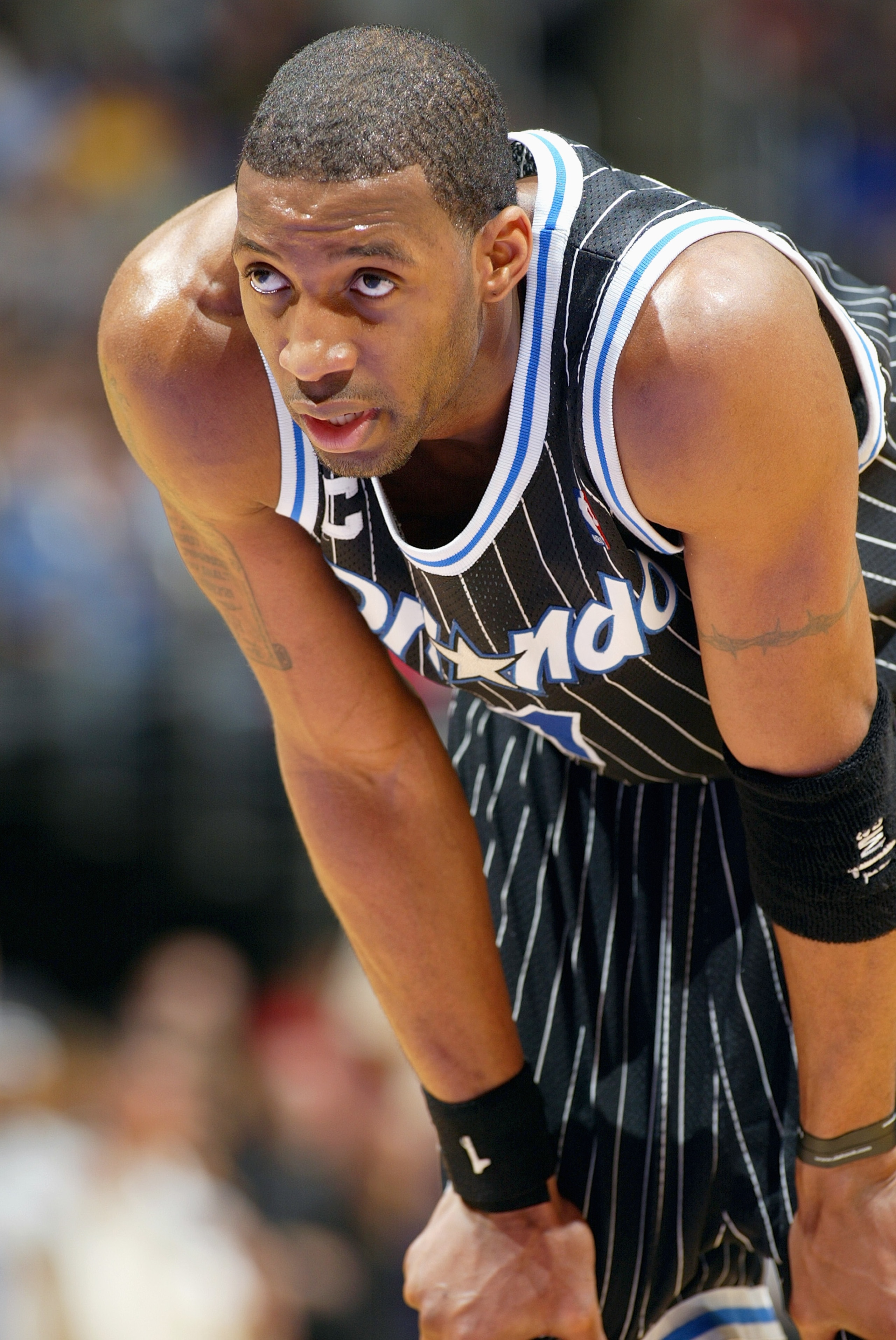 LOS ANGELES - MARCH 15: Tracy McGrady #1 of the Orlando Magic looks on during the game against the Los Angeles Lakers at Staples Center on March 15, 2004 in Los Angeles, California. The Lakers won 113-110. NOTE TO USER: User expressly acknowledges and LOS ANGELES - MARCH 15: Tracy McGrady #1 of the Orlando Magic looks on during the game against the Los Angeles Lakers at Staples Center on March 15, 2004 in Los Angeles, California. The Lakers won 113-110. NOTE TO USER: User expressly acknowledges and