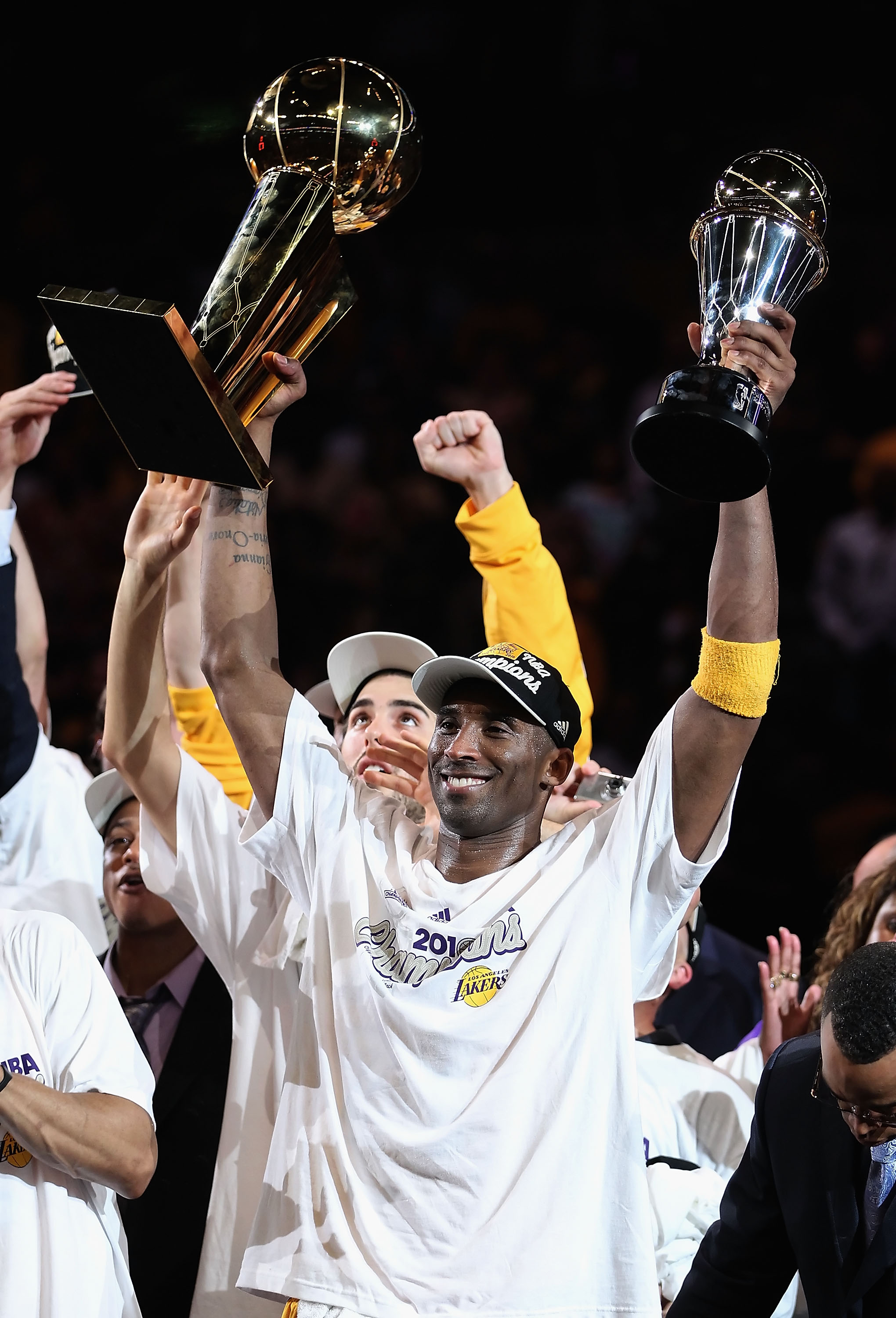 LOS ANGELES, CA - JUNE 17:  Kobe Bryant #24 of the Los Angeles Lakers holds both the Larry O'Brien trophy and the Bill Russell Finals MVP trophy after the Lakers defeated the Boston Celtics 83-79 in Game Seven of the 2010 NBA Finals at Staples Center on J
