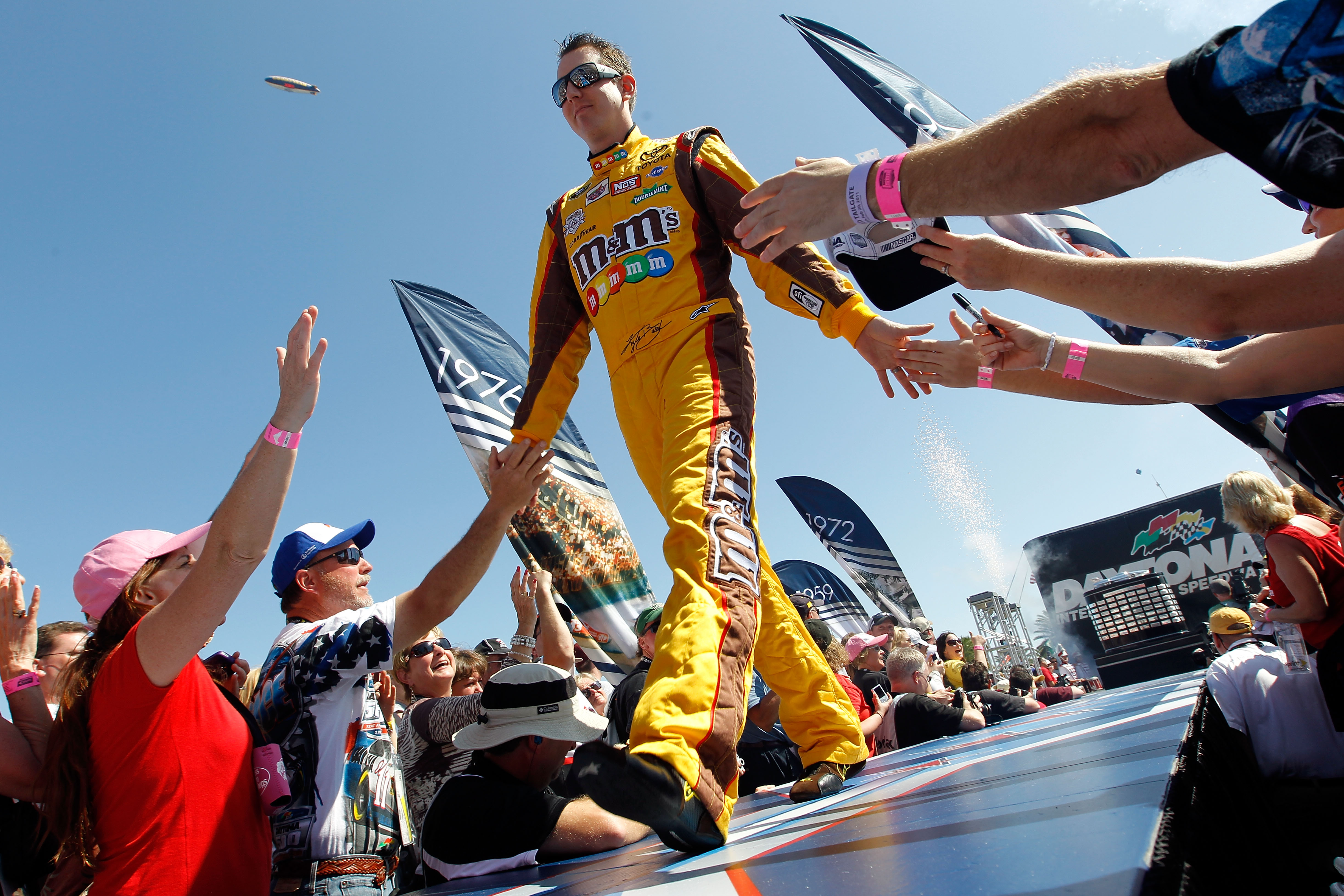 DAYTONA BEACH, FL - FEBRUARY 20:  Kyle Busch, driver of the #18 M&M'sToyota, is introduced during pre-race ceremonies for the NASCAR Sprint Cup Series Daytona 500 at Daytona International Speedway on February 20, 2011 in Daytona Beach, Florida.  (Photo by