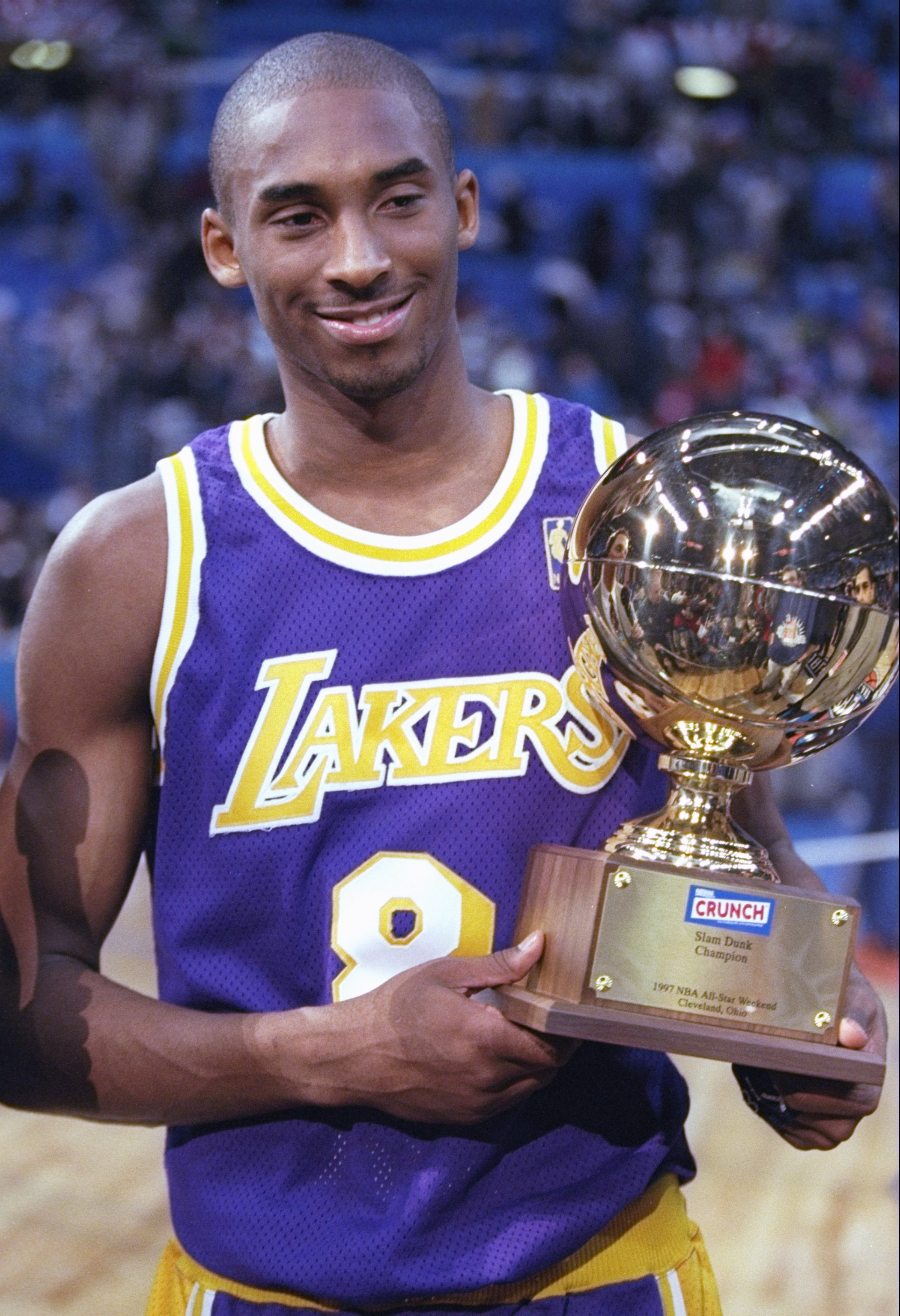 8 Feb 1997:  Guard Kobe Bryant of the Los Angeles Lakers holds the Slam Dunk Contest trophy at the Gund Arena in Cleveland, Ohio. Mandatory Credit: Brian Bahr  /Allsport