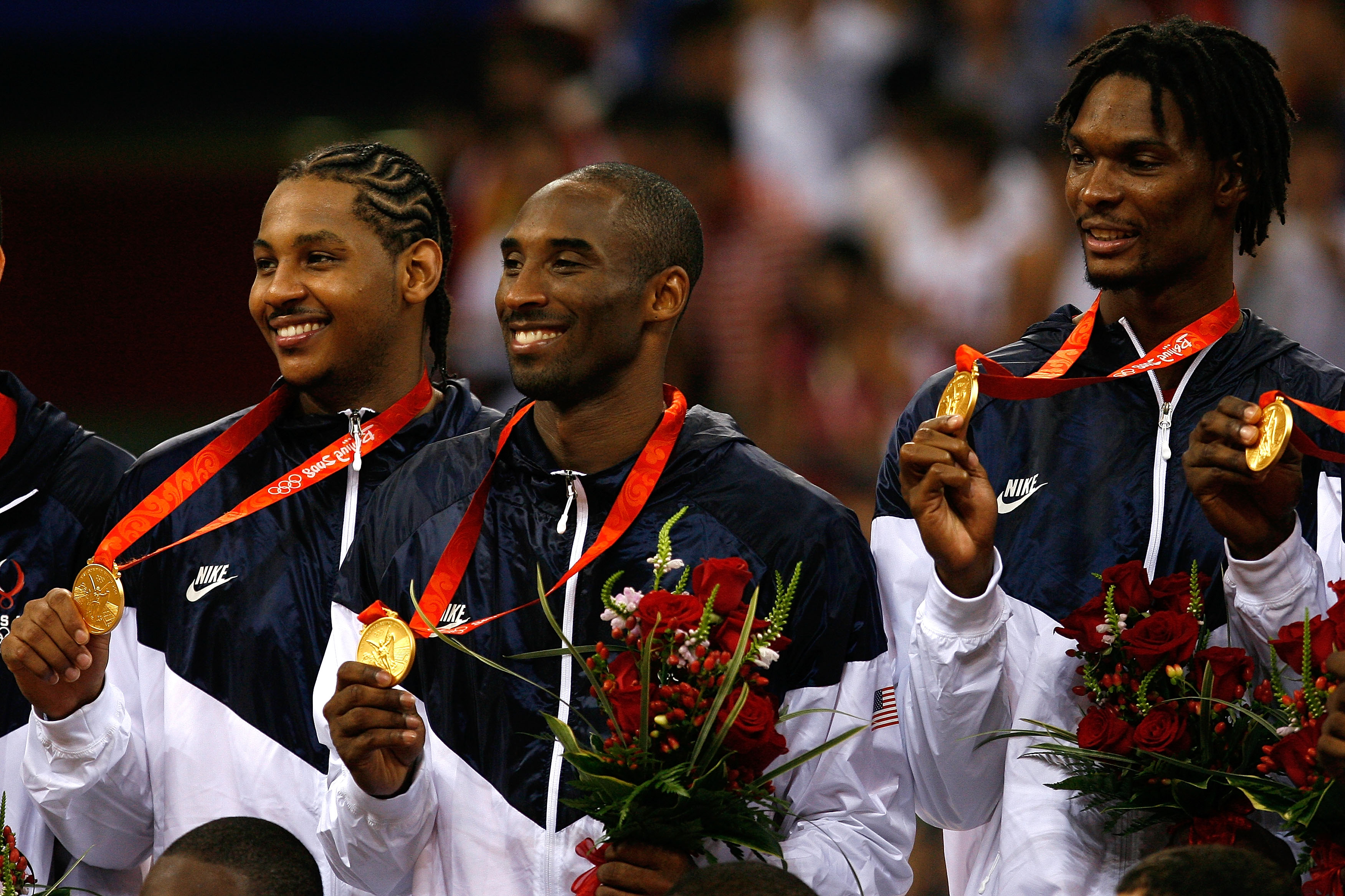 BEIJING - AUGUST 24:  (L-R) Carmelo Anthony, Kobe Bryant and Chris Bosh of the United States hold their gold medals after defeating Spain 118-107 in the gold medal game during Day 16 of the Beijing 2008 Olympic Games at the Beijing Olympic Basketball Gymn