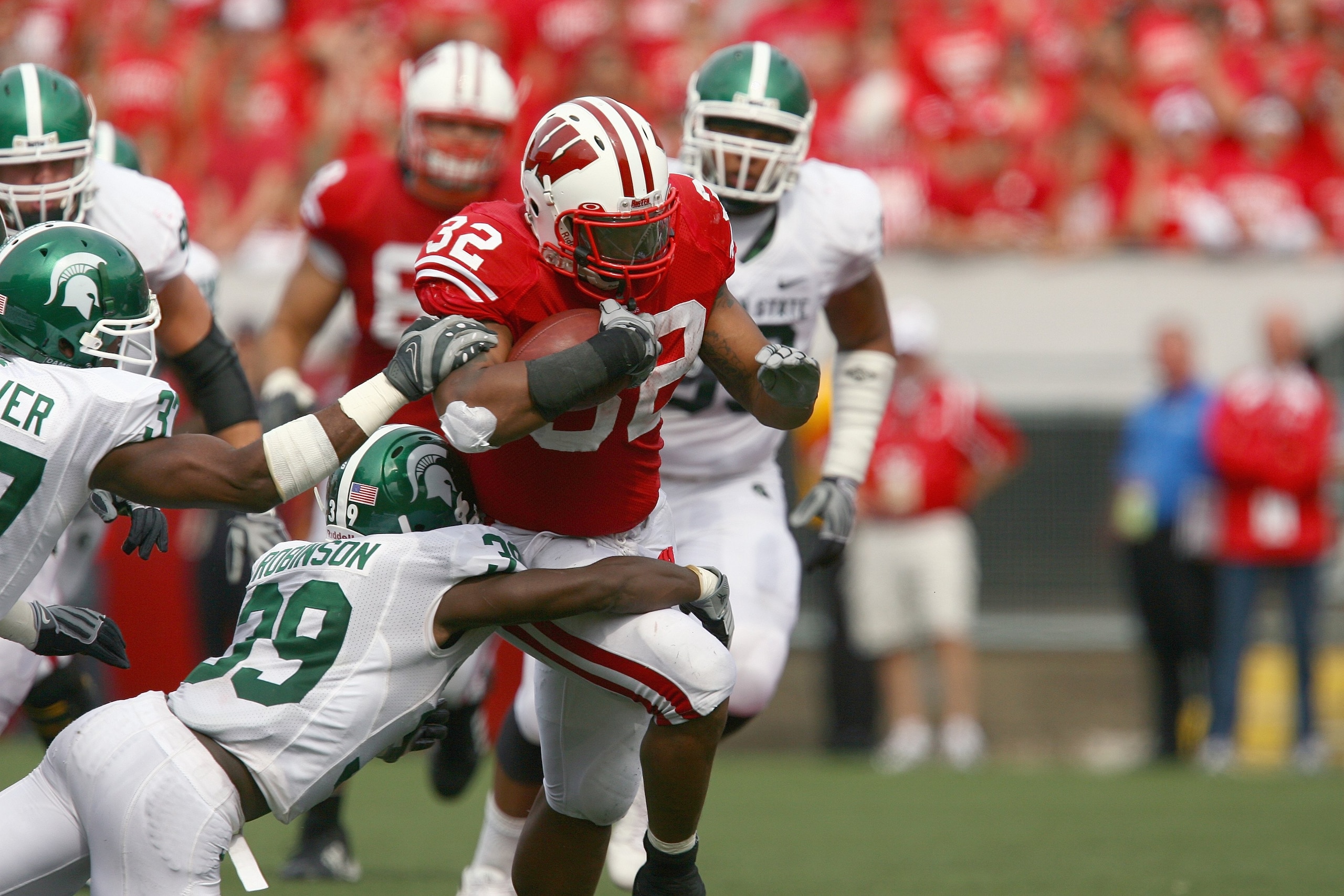 MADISON, WI - SEPTEMBER 26: John Clay #32 of the Wisconsin Badgers carries the ball against the Michigan State Spartans on September 26, 2009 at Camp Randall Stadium in Madison, Wisconsin. Wisconsin defeated Michigan State 38-30. (Photo by Jonathan Daniel