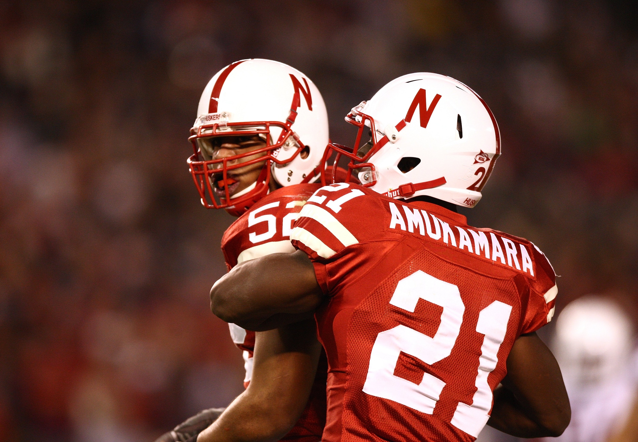 SAN DIEGO - DECEMBER 30:  Phillip Dillard #52 and #21 Prince Amukamara #21 of the University of Nebraska Cornhuskers celebrate a defensive play during the Pacific Life Holiday Bowl against University of Arizona Wildcats on December 30, 2009 at Qualcomm St