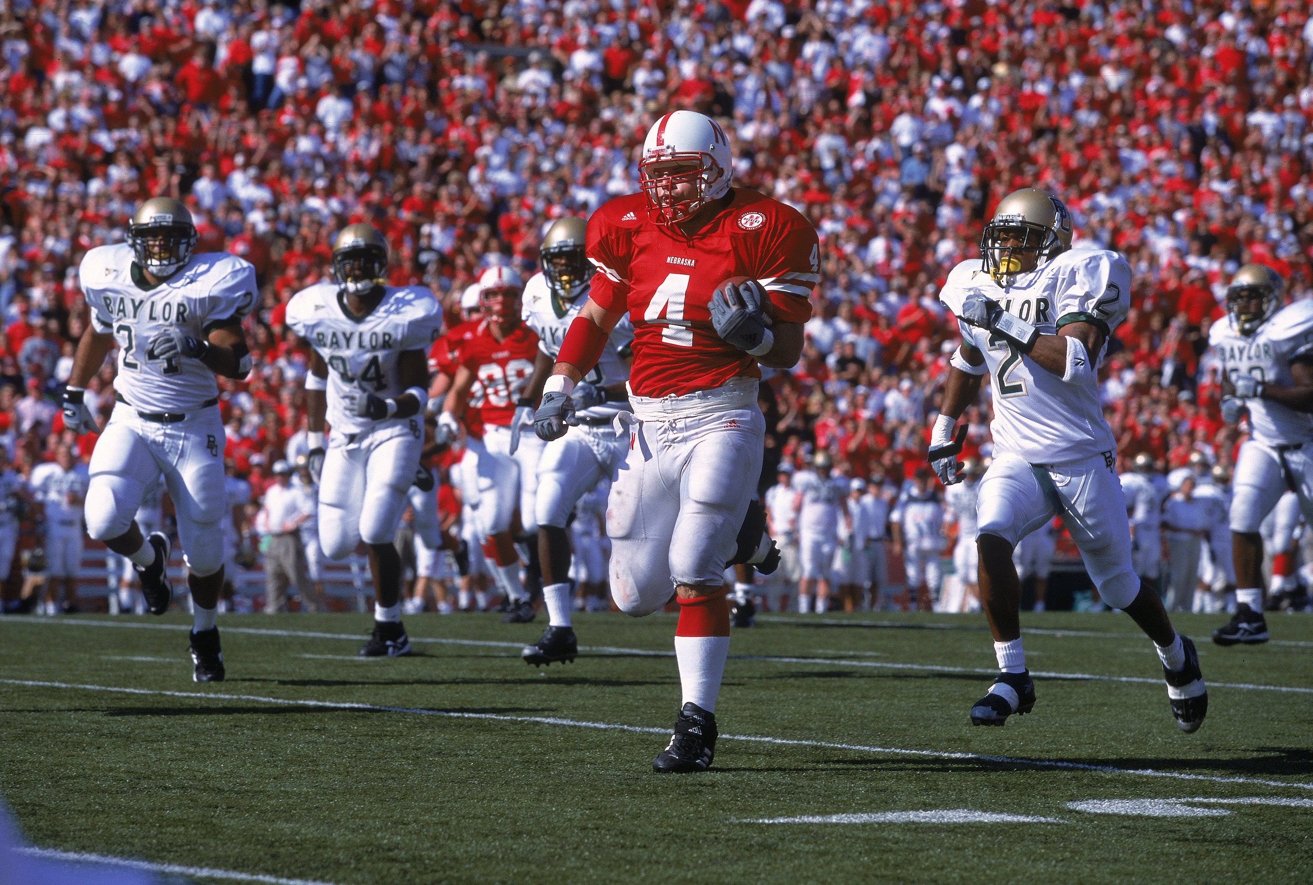21 Oct 2000:  Judd Davies #4 of the Nebraska Cornhuskers runs with the ball during the game against the Baylor Bears at the Memorial Stadium in Lincoln, Nebraska. The Cornhuskers defeated the Bears 59-0.Mandatory Credit: Brian Bahr  /Allsport