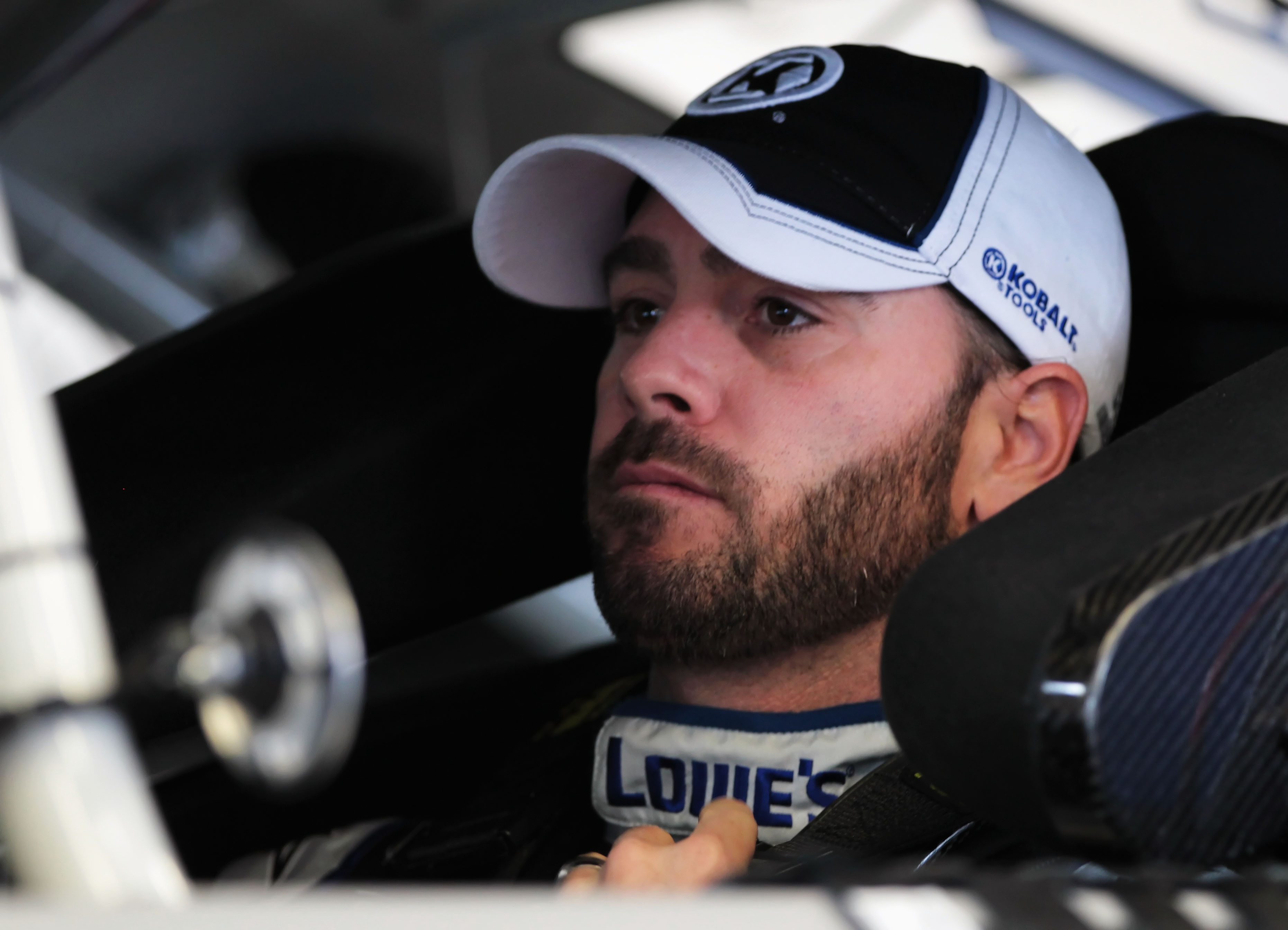 DAYTONA BEACH, FL - FEBRUARY 18:  Jimmie Johnson, driver of the #48 Lowe's Chevrolet, sits in his car in the garage area during practice for the NASCAR Sprint Cup Series Daytona 500 at Daytona International Speedway on February 18, 2011 in Daytona Beach,