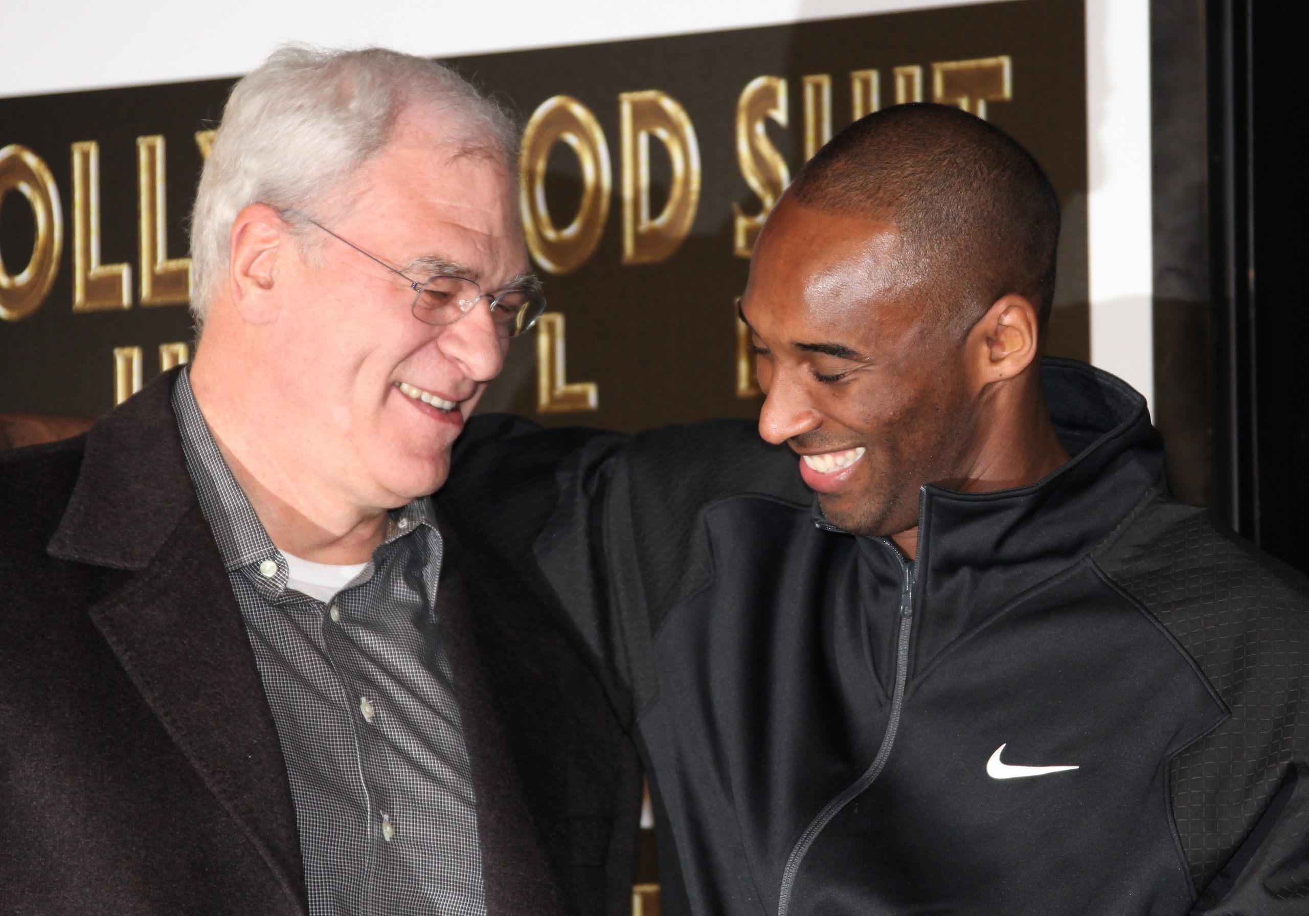 HOLLYWOOD, CA - FEBRUARY 19:  Los Angeles Lakers head coach Phil Jackson (L) and NBA player Kobe Bryant attend Bryant's hand and footprint ceremony at Grauman's Chinese Theater on February 19, 2011 in Hollywood, California.  (Photo by David Livingston/Get