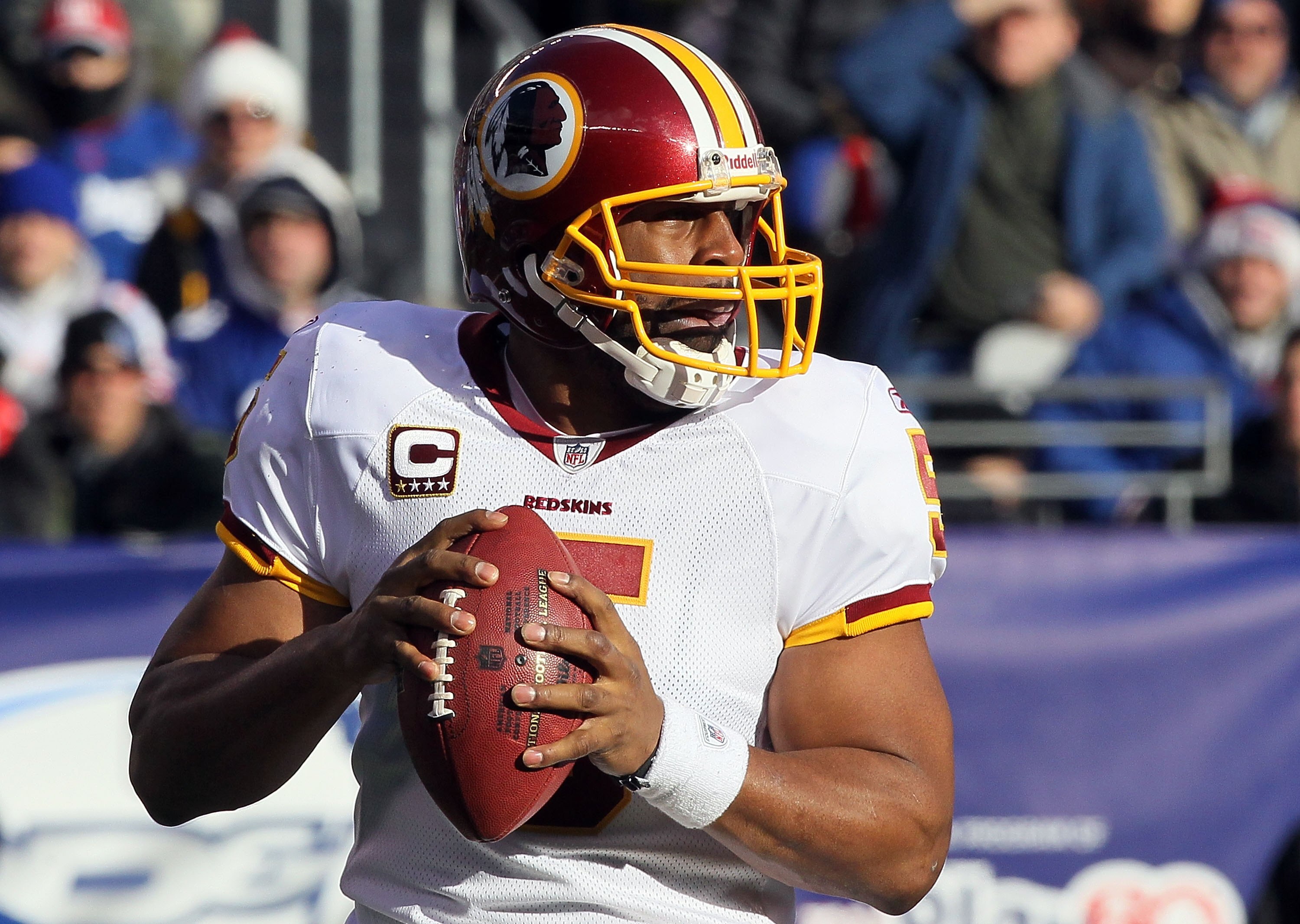 EAST RUTHERFORD, NJ - DECEMBER 05:  Donovan McNabb #5 of the Washington Redskins looks to throw a pass against the New York Giants on December 5, 2010 at the New Meadowlands Stadium in East Rutherford, New Jersey. The Giants defeated the Redskins 31-7.  (