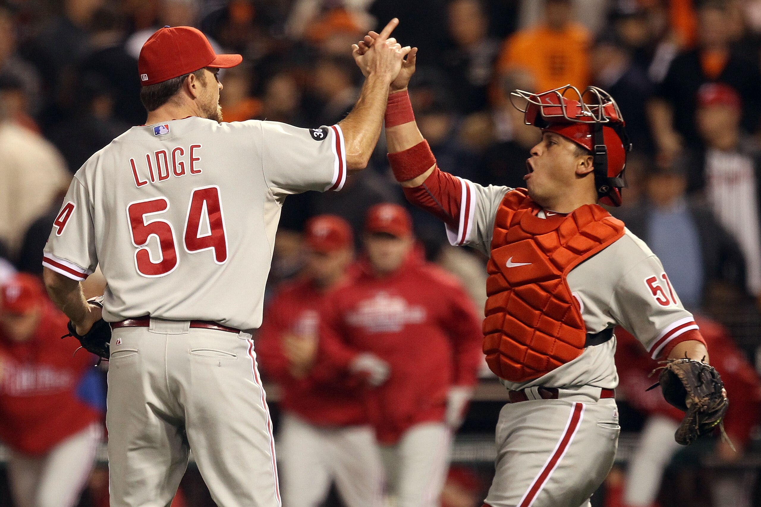 SAN FRANCISCO - OCTOBER 21:  Brad Lidge #54 and Carlos Ruiz #51 of the Philadelphia Phillies celebrate after defeating the San Francisco Giants 4-2 in Game Five of the NLCS during the 2010 MLB Playoffs at AT&T Park on October 21, 2010 in San Francisco, Ca