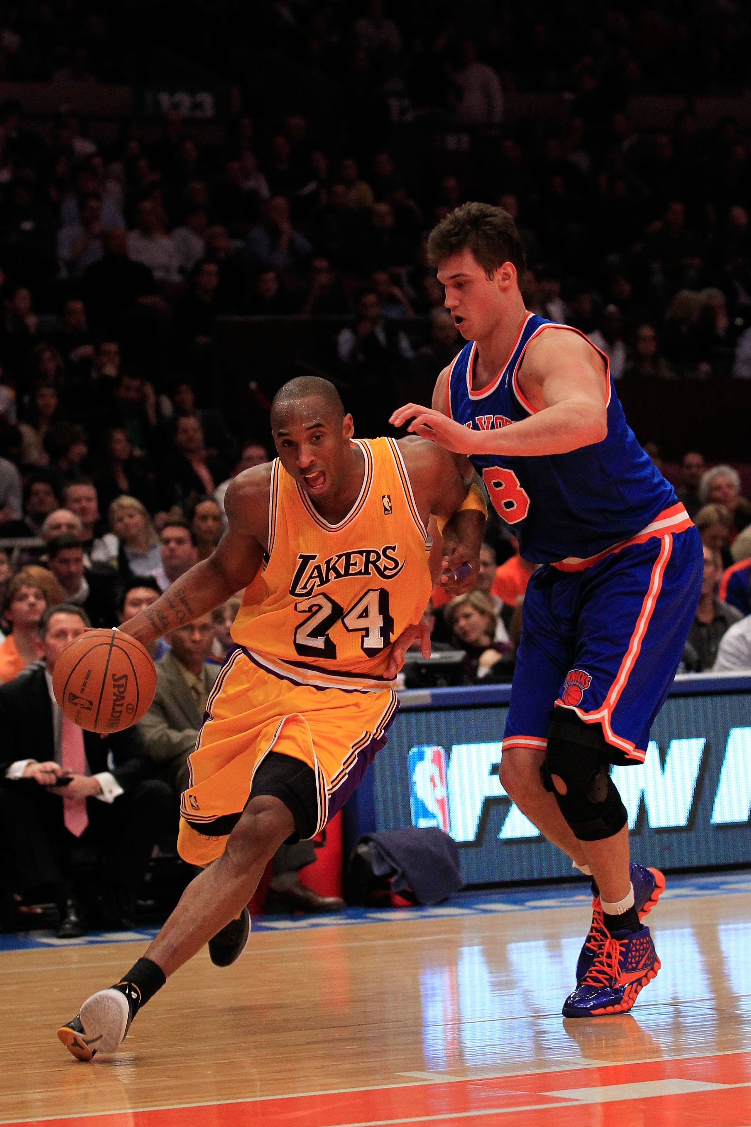 NEW YORK, NY - FEBRUARY 11: Kobe Bryant #24 of the Los Angeles Lakers drives past Danilo Gallinari #8 of the New York Knicks at Madison Square Garden on February 11, 2011 in New York City. NOTE TO USER: User expressly acknowledges and agrees that, by down