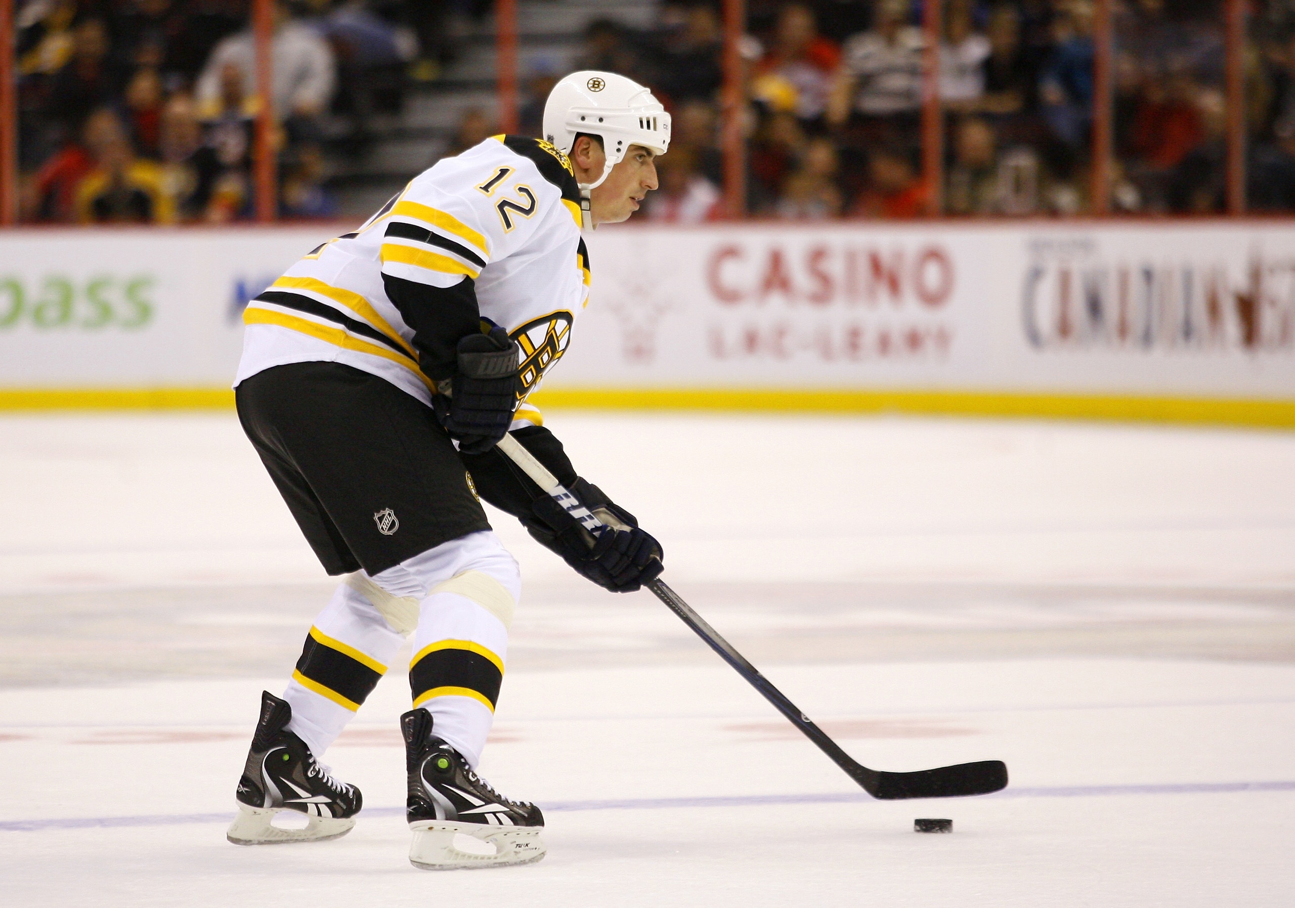OTTAWA, ON - FEBRUARY 18:  Tomas Kaberle #12 of the Boston Bruins controls the puck at the blueline during a game against the Ottawa Senators at Scotiabank Place on February 18, 2011 in Ottawa, Canada.  (Photo by Phillip MacCallum/Getty Images)