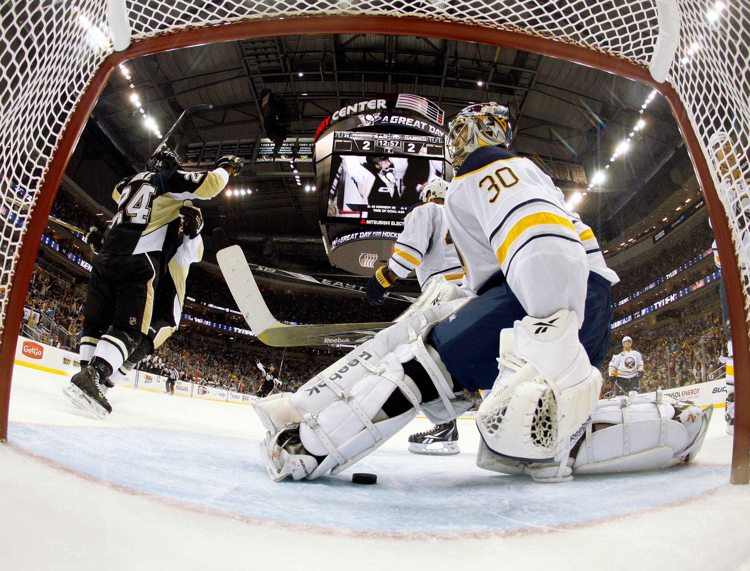 PITTSBURGH, PA - FEBRUARY 04:  Matt Cooke #24 of the Pittsburgh Penguins celebrates his second period goal in front of Ryan Miller #30 of the Buffalo Sabres at Consol Energy Center on February 4, 2011 in Pittsburgh, Pennsylvania.  (Photo by Justin K. Alle