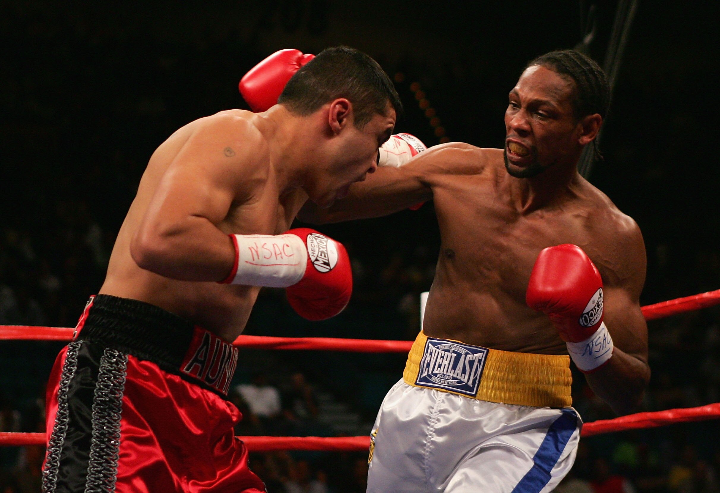 LAS VEGAS - SEPTEMBER 17: Leavander Johnson (R) throws a right against Jesus Chavez during the IBF Lightweight World Title Bout at the MGM Grand Garden Arena on September 17, 2005 in Las Vegas, Nevada. Johnson collapsed in the locker room after the fight