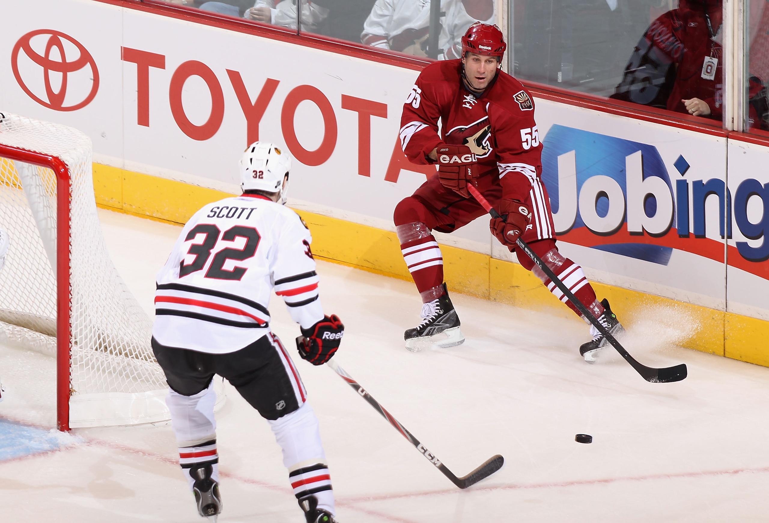 GLENDALE, AZ - FEBRUARY 12:  Ed Jovanovski #55 of the Phoenix Coyotes passes the puck during the NHL game against the Chicago Blackhawks at Jobing.com Arena on February 12, 2011 in Glendale, Arizona. The Coyotes defeated the Blackhawks 3-2 in an overtime 