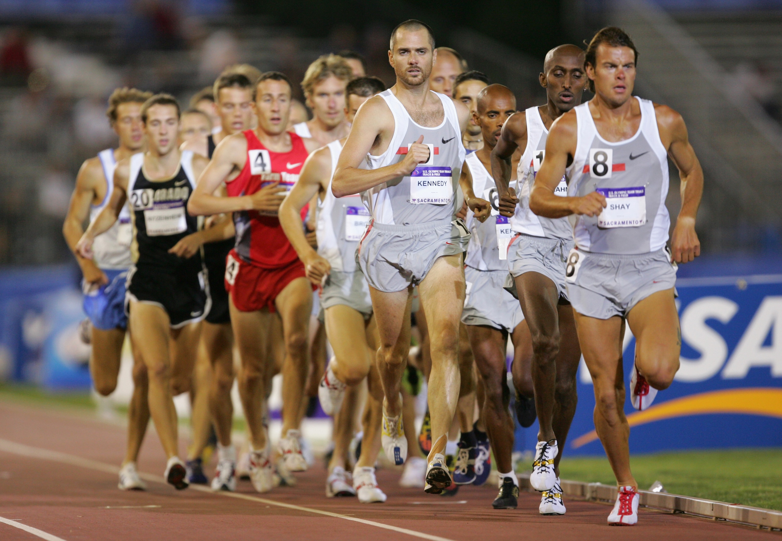 SACRAMENTO, CA - JULY 9:  Bob Kennedy #10 and Ryan Shay #8 of Nike compete in the 10000 Meter Run during the U.S. Olympic Team Track & Field Trials on July 9, 2004 at the Alex G. Spanos Sports Complex in Sacramento, California.  (Photo by Jamie Squire/Get