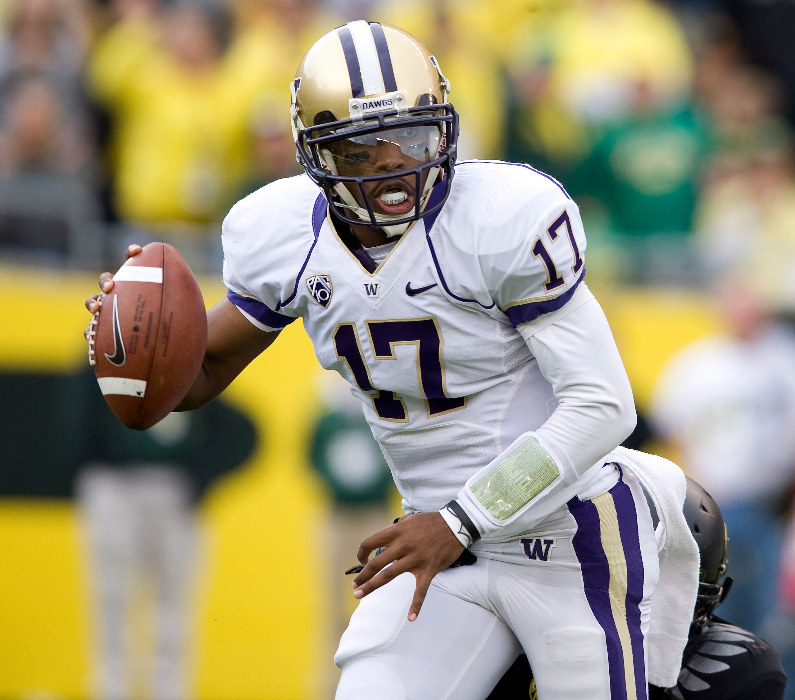 EUGENE, OR - NOVEMBER 06: Quarterback Keith Price #17 of the Washington Huskies scrambles out of the pocket in the third quarter of the game against the Oregon Ducks at Autzen Stadium on November 6, 2010 in Eugene, Oregon. The Ducks won the game 53-16. (P